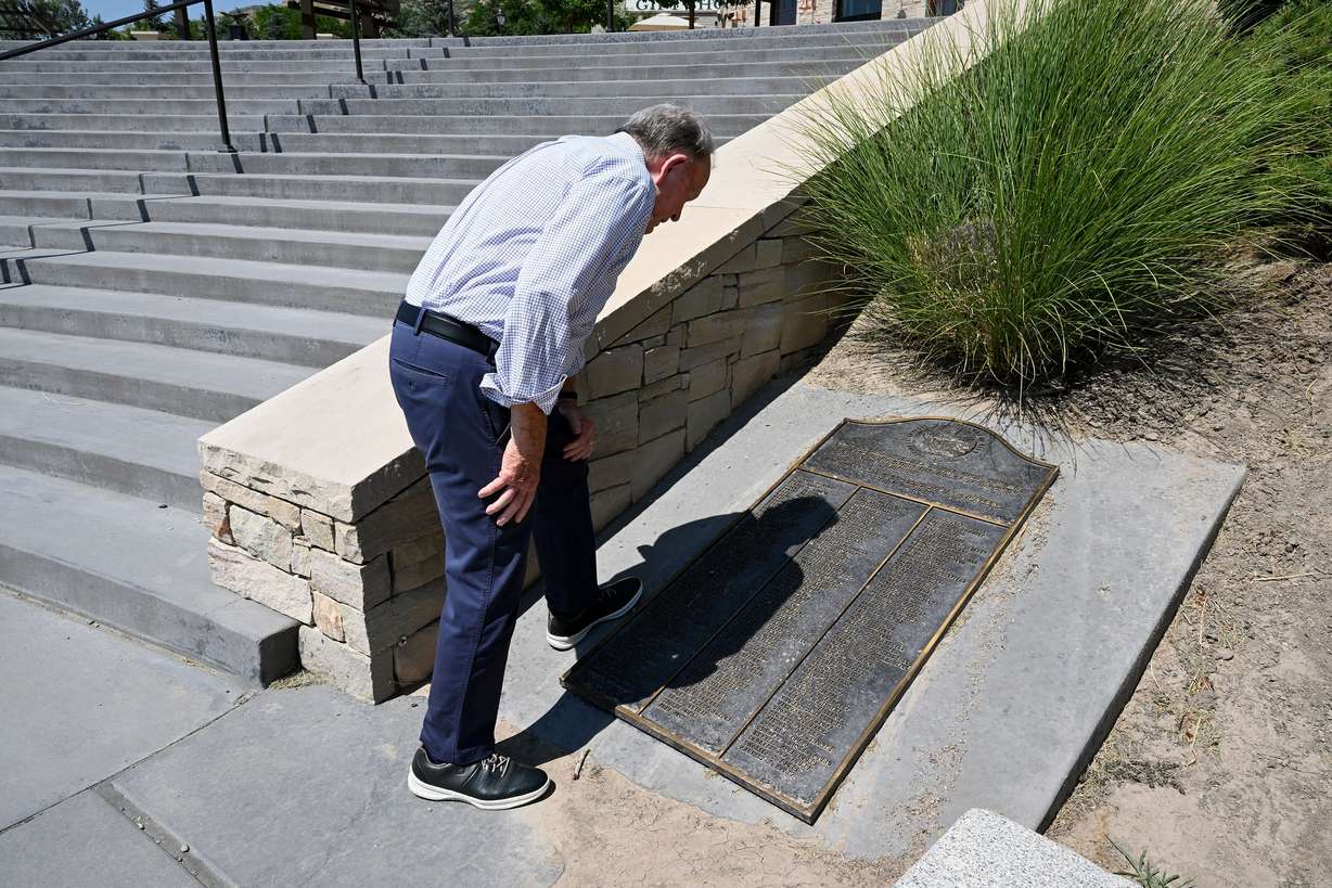 Ellis Ivory, executive director of This Is the Place Heritage Park in Salt Lake City, points out his great grandfather Mathew Ivory’s name on the list of the first company to arrive in the Salt Lake Valley. This photo was taken at the park on July 9.