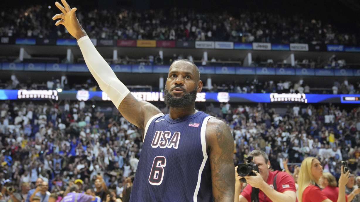 United States' forward LeBron James waves to the crowd after the end of an exhibition basketball game between the United States and South Sudan, at the o2 Arena in London, Saturday, July 20, 2024.