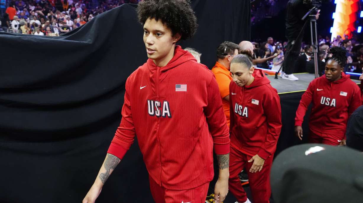 Brittney Griner, left, Diana Taurasi, and Chelsea Gray, of Team USA, walk on the court prior to a WNBA All-Star basketball game against Team WNBA, Saturday, July 20, 2024, in Phoenix.