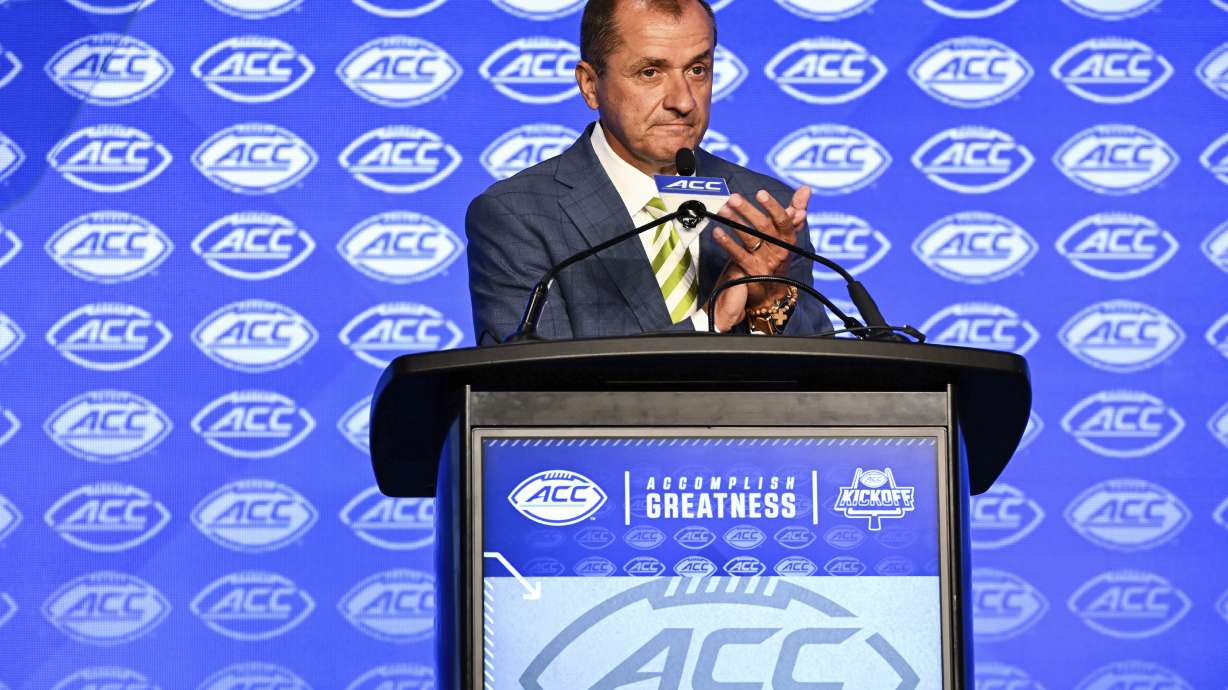 Atlantic Coast Conference commissioner Jim Phillips speaks during an NCAA college football news conference at the ACC media days, Monday, July 22, 2024, in Charlotte, N.C.