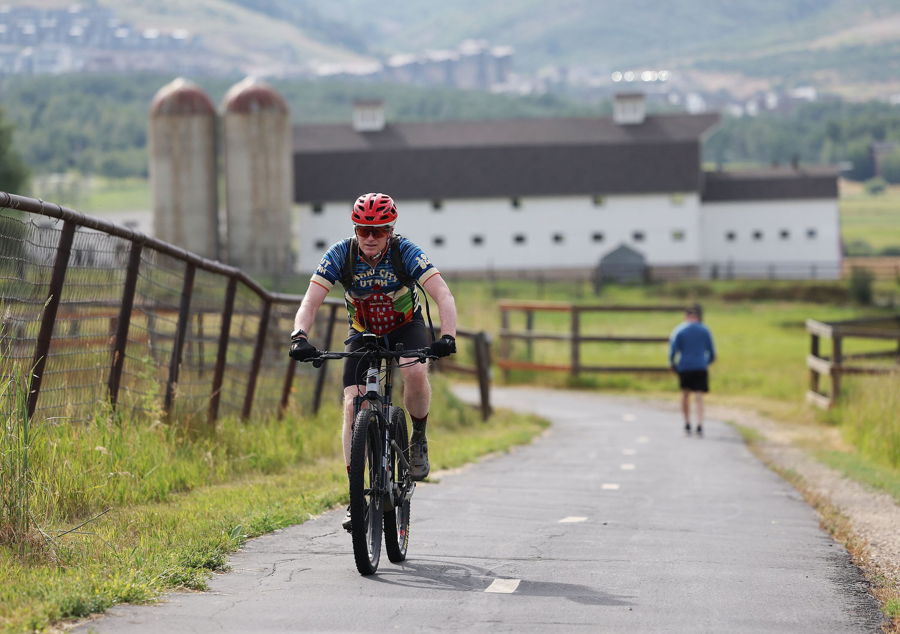 Scott Burton rides on a trail in Park City on Thursday. Ski areas turn into biking playgrounds after the snow melts.
