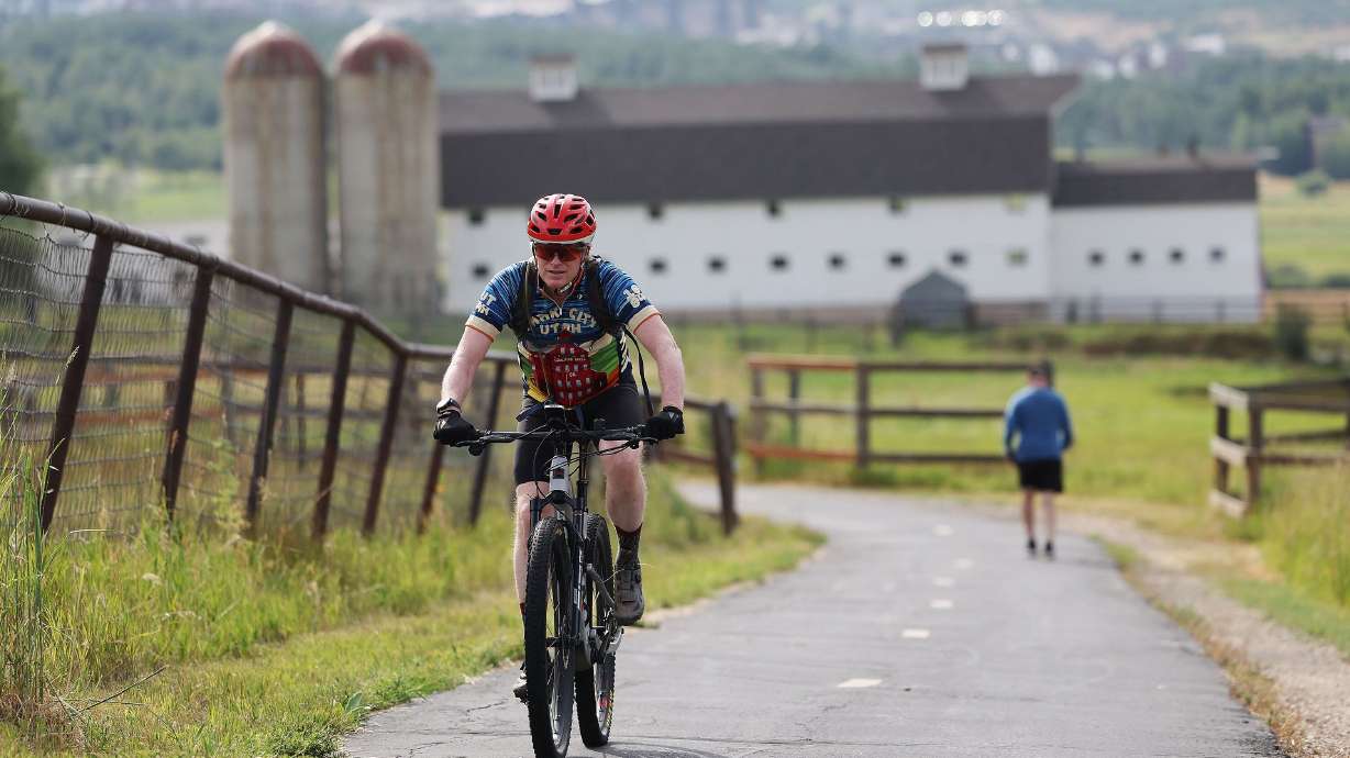 Scott Burton rides on a trail in Park City on Thursday. Ski areas turn into biking playgrounds after the snow melts.