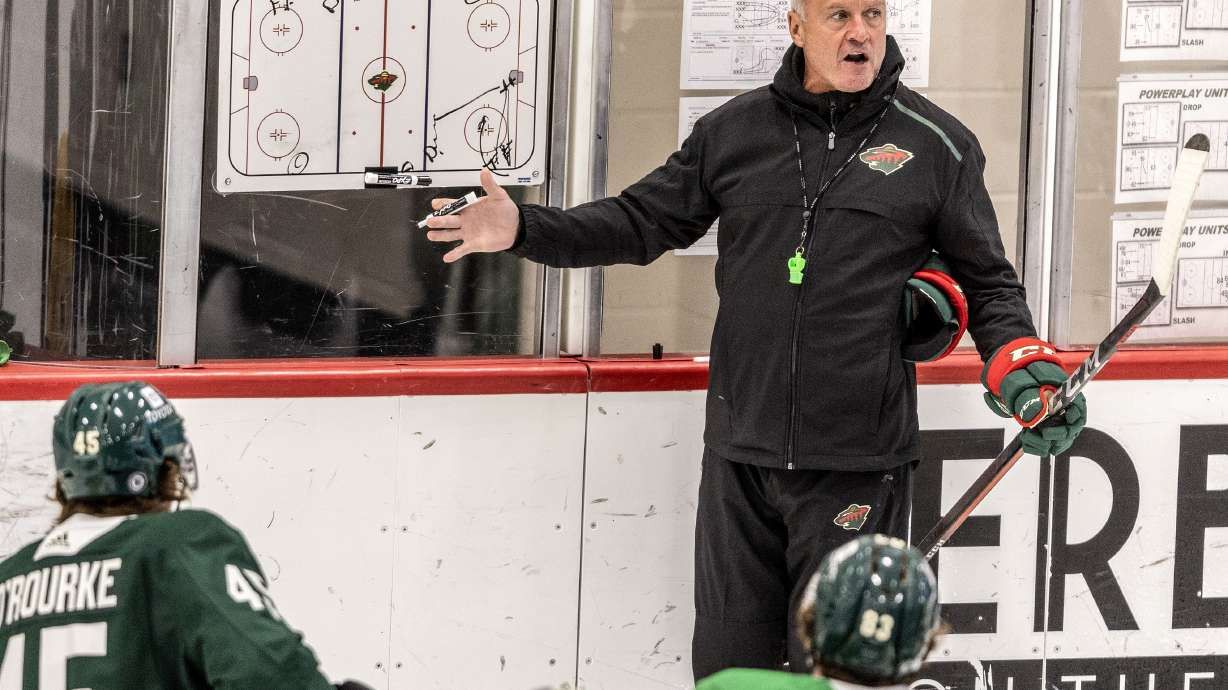 FILE - Minnesota Wild head coach Dean Evason speaks to players during NHL hockey training camp Sept. 22, 2022, in St. Paul, Minn. The Columbus Blue Jackets announced Monday, July 22, 2024, that they've hired Dean Evason as their new coach.