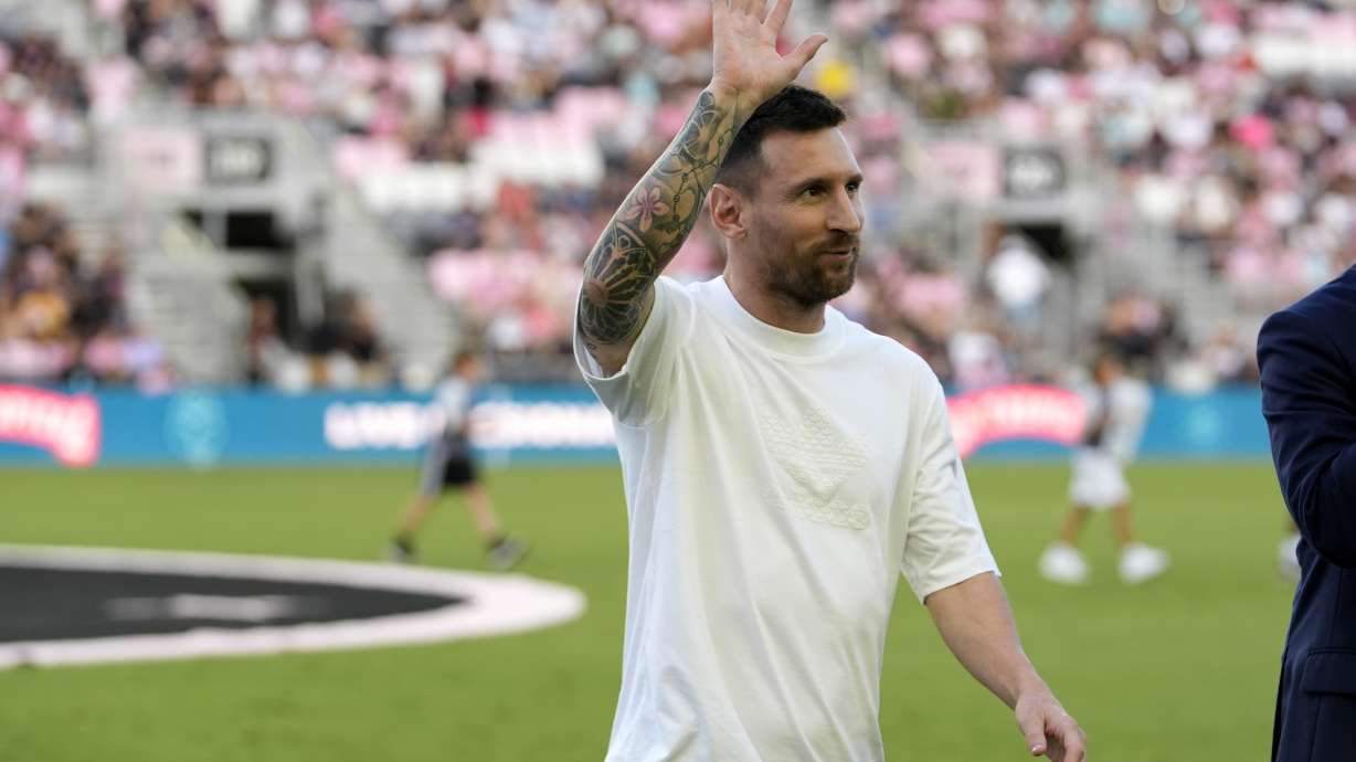 Inter Miami forward Lionel Messi waves as he walks off the field after being honored for his 45 career trophies before an MLS soccer match against the Chicago Fire, Saturday, July 20, 2024, in Fort Lauderdale, Fla.