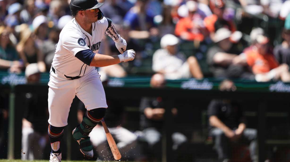 Seattle Mariners' Ty France watches his single against the Baltimore Orioles during the fifth inning of a baseball game Thursday, July 4, 2024, in Seattle.