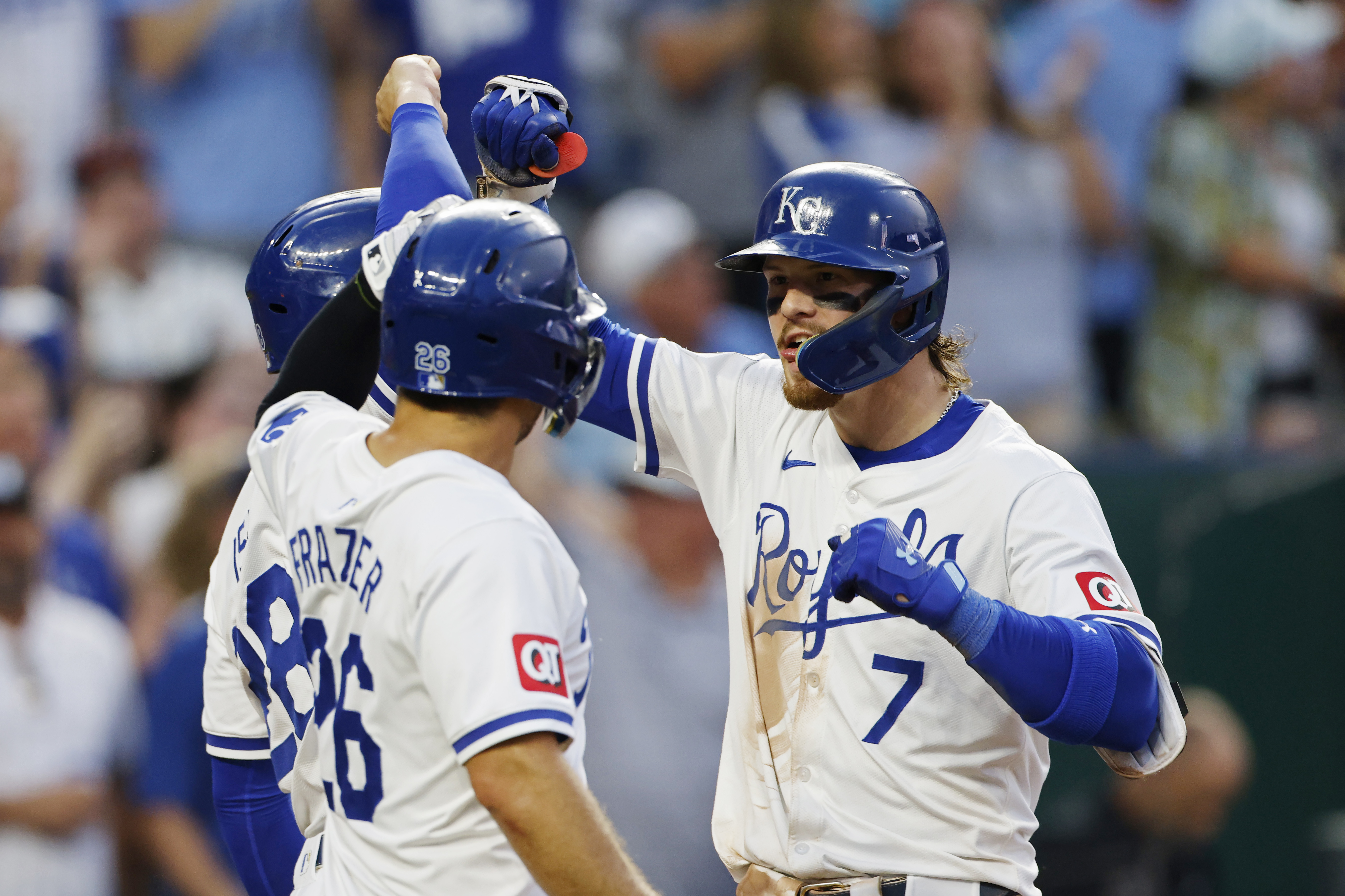 Kansas City Royals' Bobby Witt Jr. (7) celebrates after his three-run home run with Kyle Isbel, back left, and Adam Frazier, front left, during the fourth inning of a baseball game against the Arizona Diamondbacks in Kansas City, Mo., Monday, July 22, 2024.
