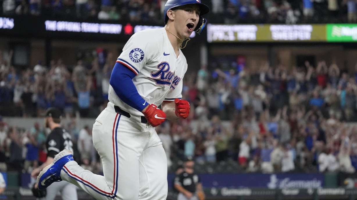 Texas Rangers' Wyatt Langford yells after hitting a single which scored teammate Travis Jankowski during the 10th nning of a baseball game against the Chicago White Sox in Arlington, Texas, Monday, July 22, 2024.