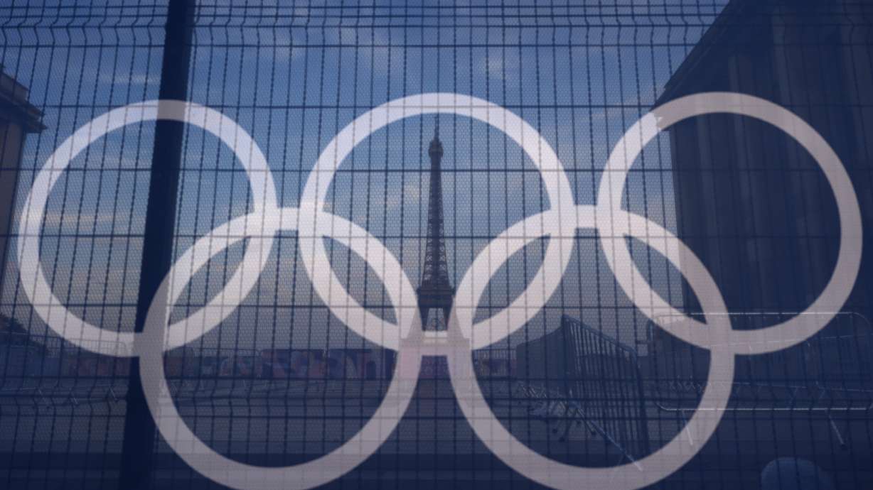 FILE - The Eiffel Tower is seen behind the Olympic rings, at the Trocadero plaza Thursday, July 18, 2024 in Paris.