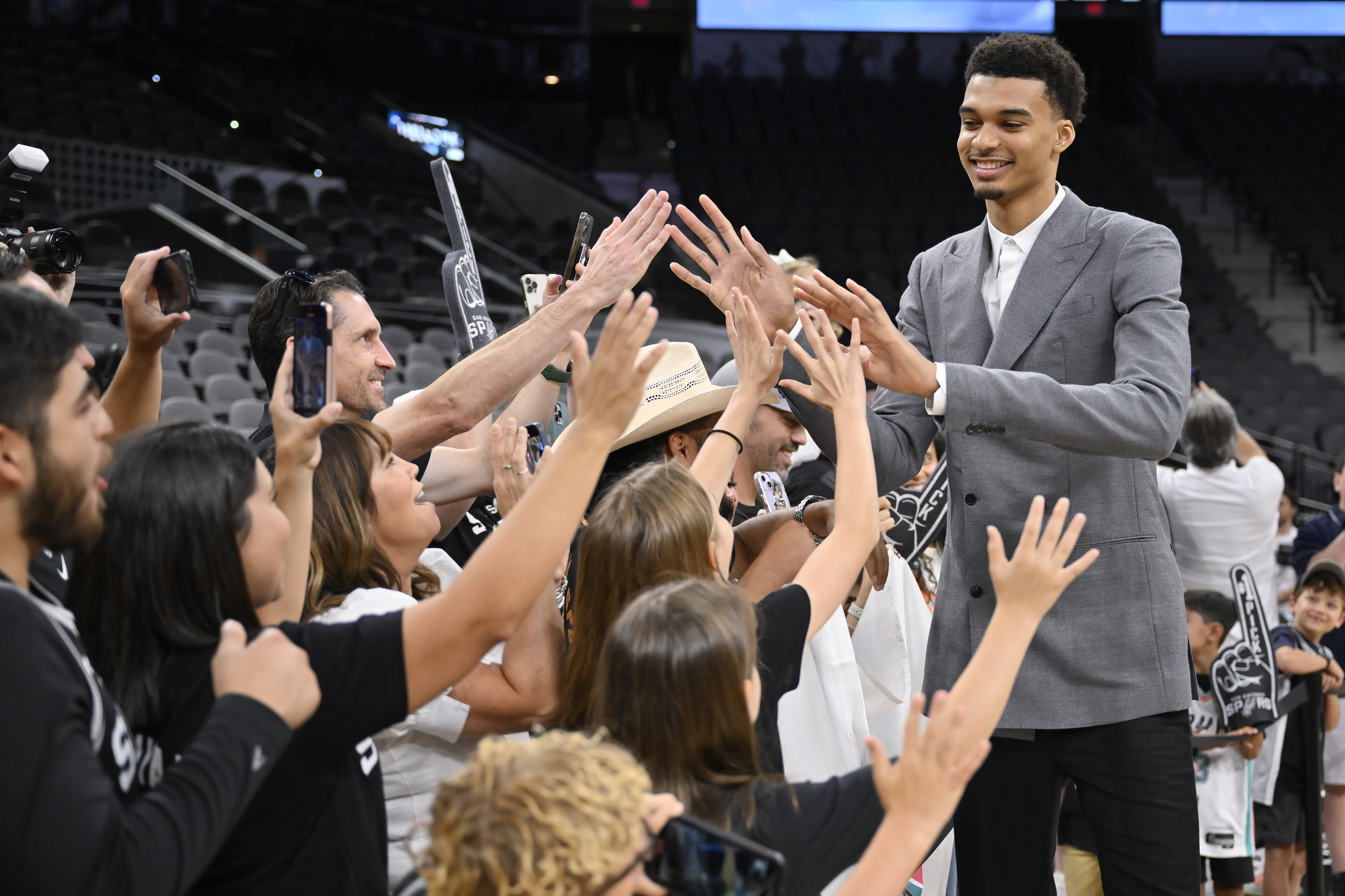 FILE - San Antonio Spurs' Victor Wembanyama, the No. 1 draft pick, greets fans before an NBA basketball press conference, Saturday, June 24, 2023, at the AT&T Center in San Antonio.