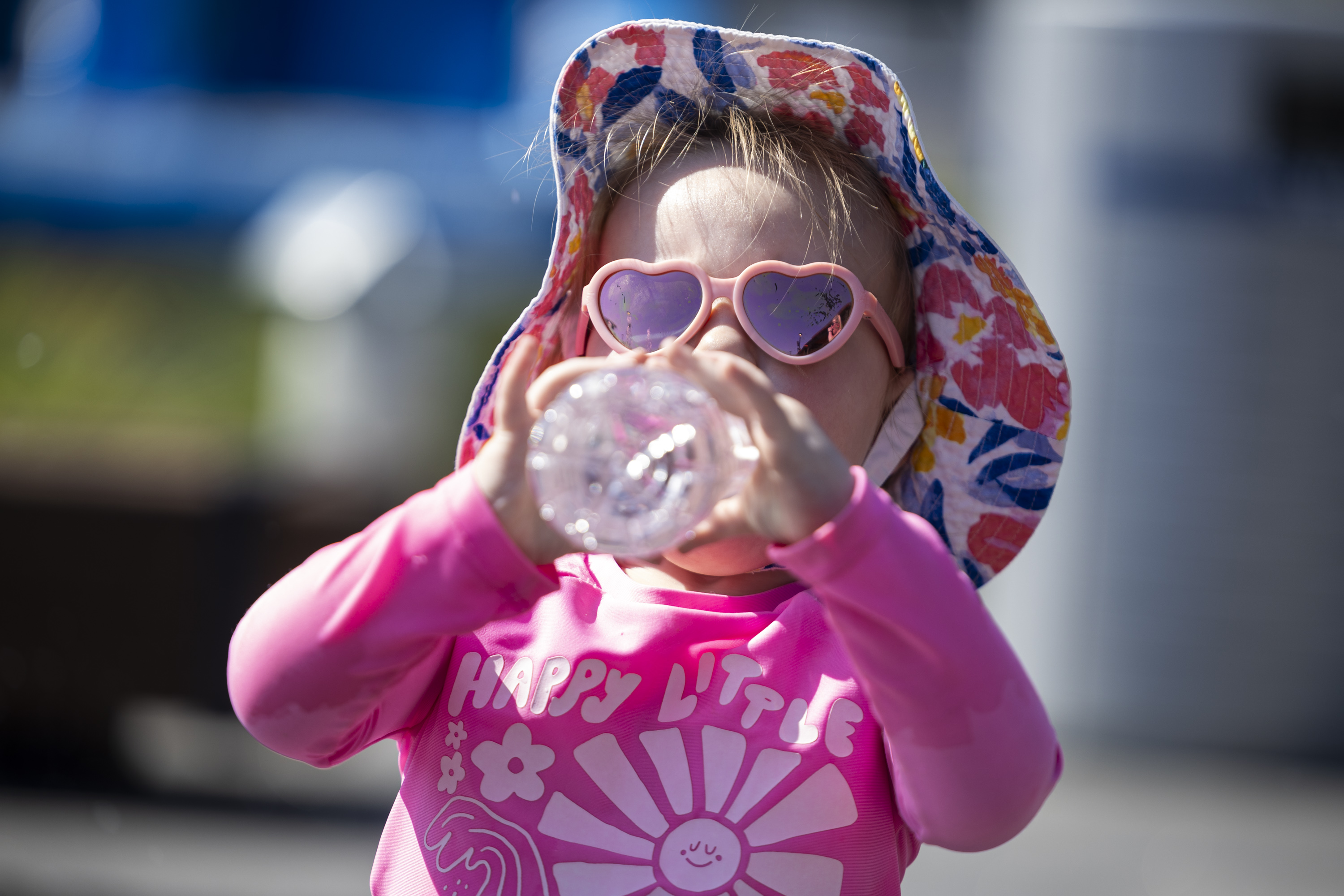 Sophie Belles, 1, of Rose Park, drinks water to beat the heat at the Millcreek Common splash pad in Millcreek on July 10. A heat advisory is in place across a large chunk of Utah for Pioneer Day.