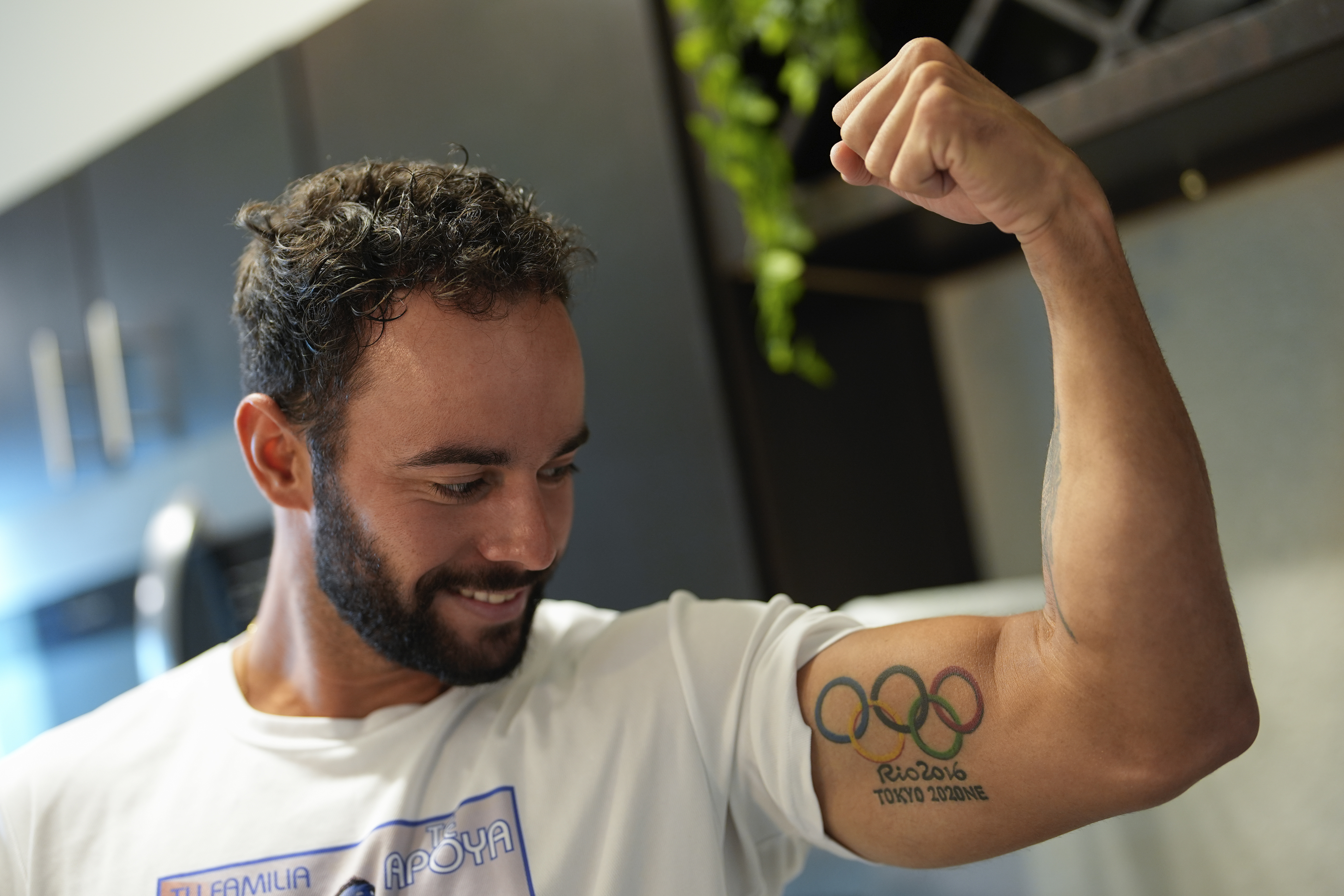FILE - Fernando Dayán Jorge displays an Olympic tattoo on his bicep, June 26, 2024, in Cape Coral, Fla. On Tuesday, July 13, the Cuban Olympic Committee demanded the “immediate exclusion” of an island athlete who was included by the organizers as part of a refugee team that will participate in the Paris 2024 Olympic Games. The committee did not mention the name of the athlete, but canoeist Dayán Jorge has been outspoken in his criticism of the country.