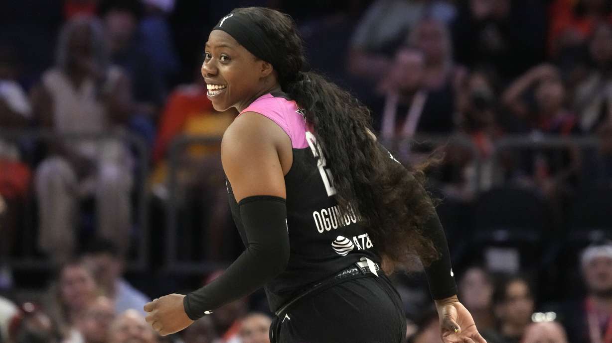 Arike Ogunbowale, of Team WNBA, smiles after hitting a 3-pointer against Team USA during the second half of a WNBA All-Star basketball game Saturday, July 20, 2024, in Phoenix.