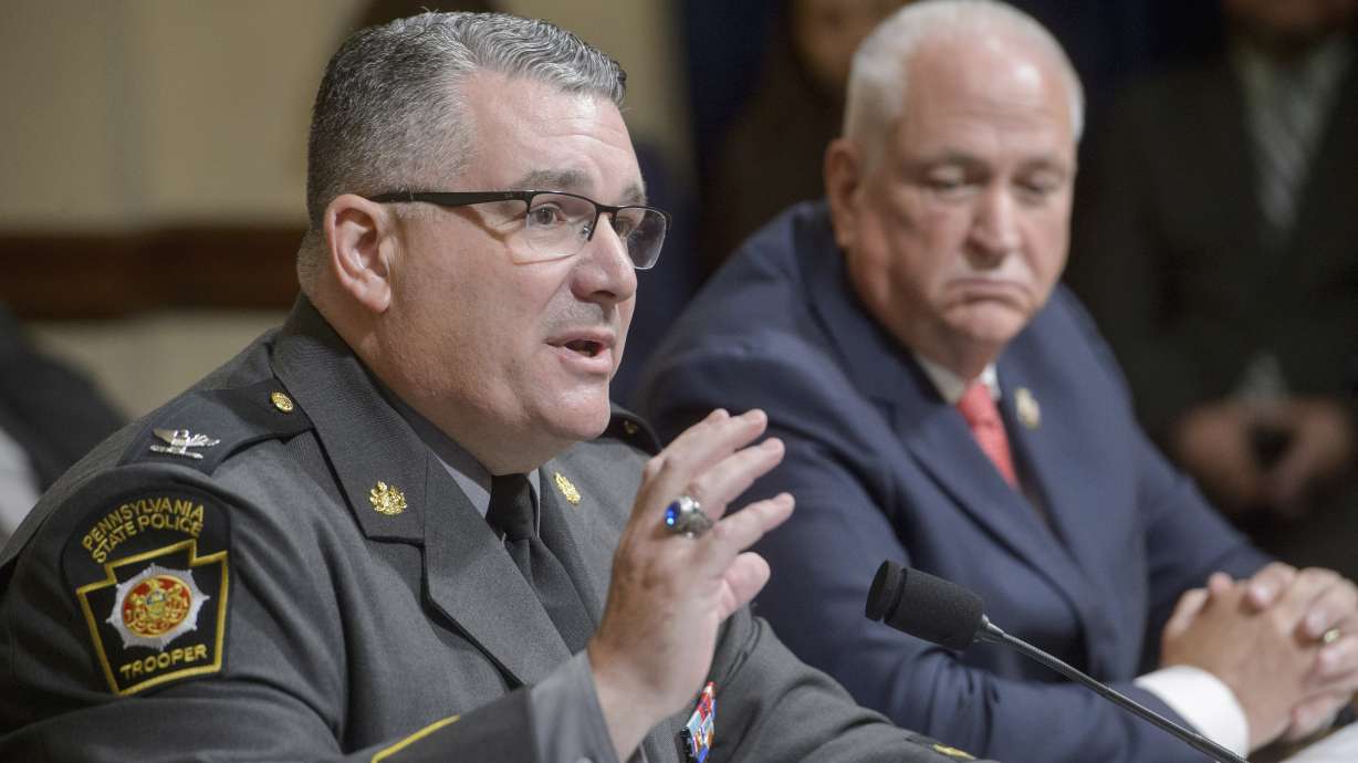 Patrick Yoes of the Fraternal Order of Police, right, listens as Col. Christopher L. Paris of the Pennsylvania State Police, left, attends a House hearing examining the assassination attempt of July 13, on Capitol Hill, Tuesday in Washington.