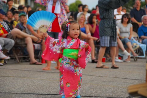 Maia Yoshida, 2, participates in a traditional Obon Festival dance in 2010.