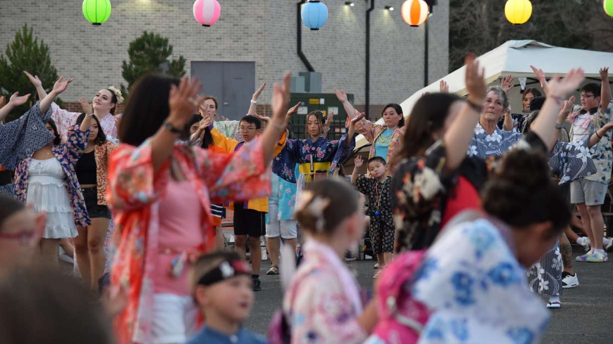 Maia Yoshida, rear center, participates in a traditional dance at the Obon Festival on July 20 at the Buddhist Church of Ogden. The church held its annual Obon Festival over the weekend to honor ancestors and loved ones lost.