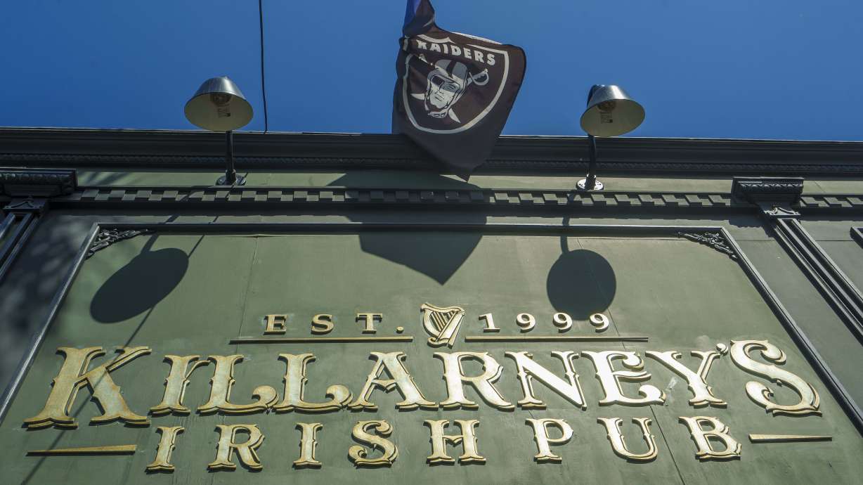 A Raiders football team flag is displayed outside Killarney's Irish Pub in Huntington Beach, Calif., Tuesday, July 23, 2024.