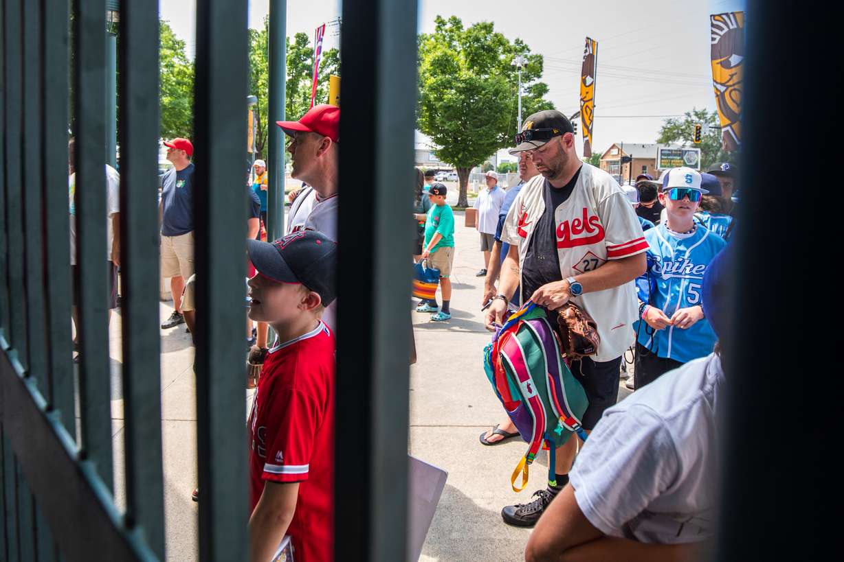 Fans line up outside of the Smith's Ballpark gates before batting practice on July 23.