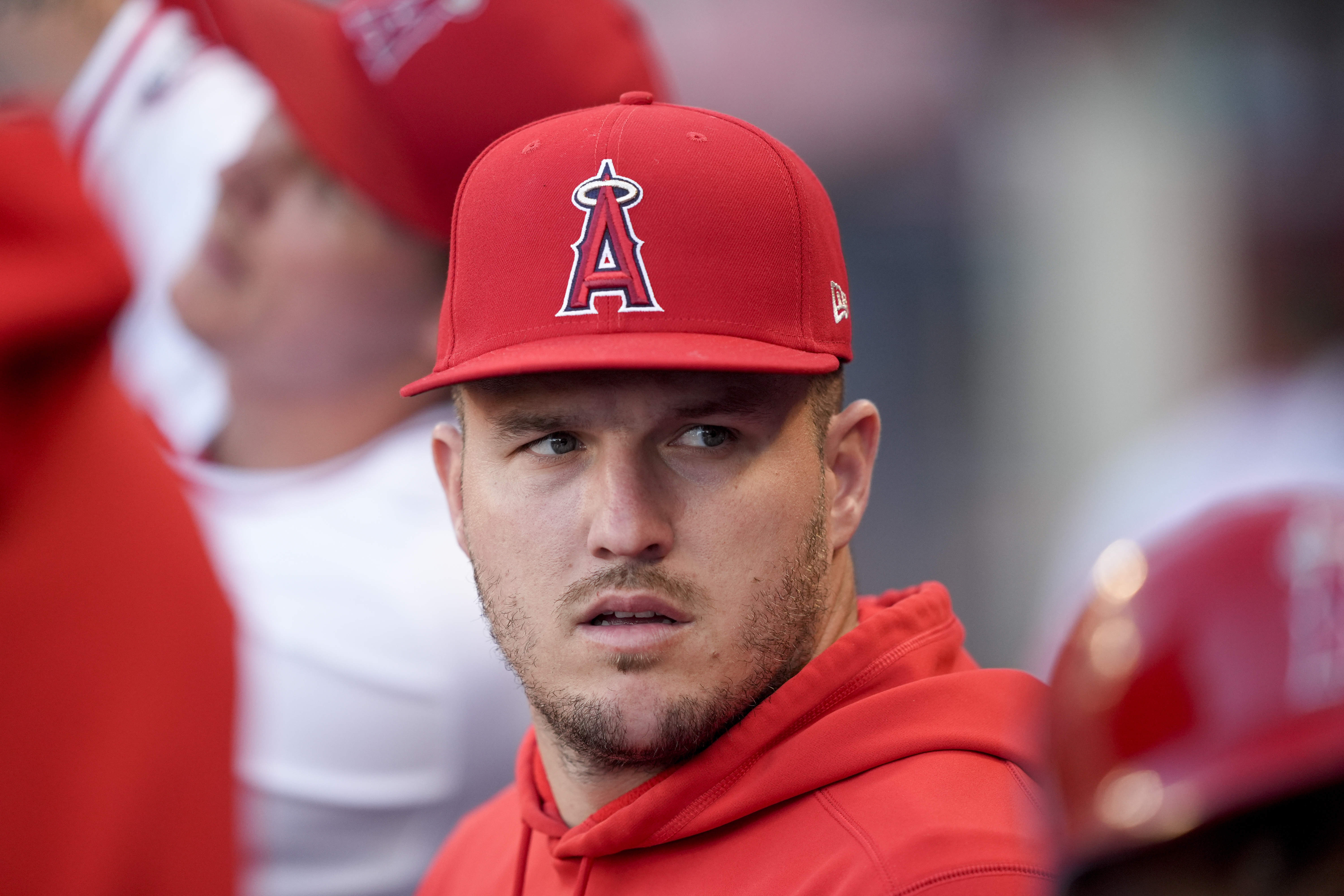 Los Angeles Angels center fielder Mike Trout sits in the dugout during the first inning of the team's baseball game against the Oakland Athletics, Tuesday, June 25, 2024, in Anaheim, Calif. 