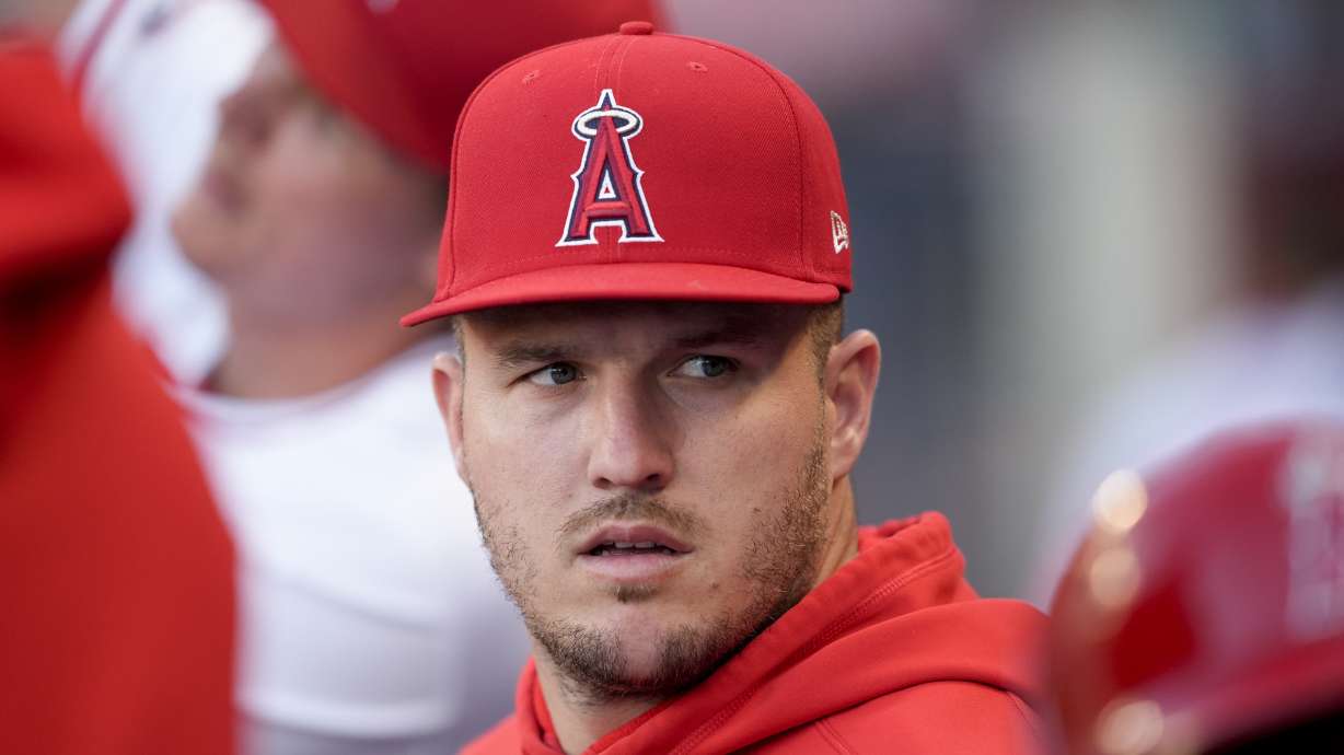 Los Angeles Angels center fielder Mike Trout sits in the dugout during the first inning of the team's baseball game against the Oakland Athletics, Tuesday, June 25, 2024, in Anaheim, Calif.