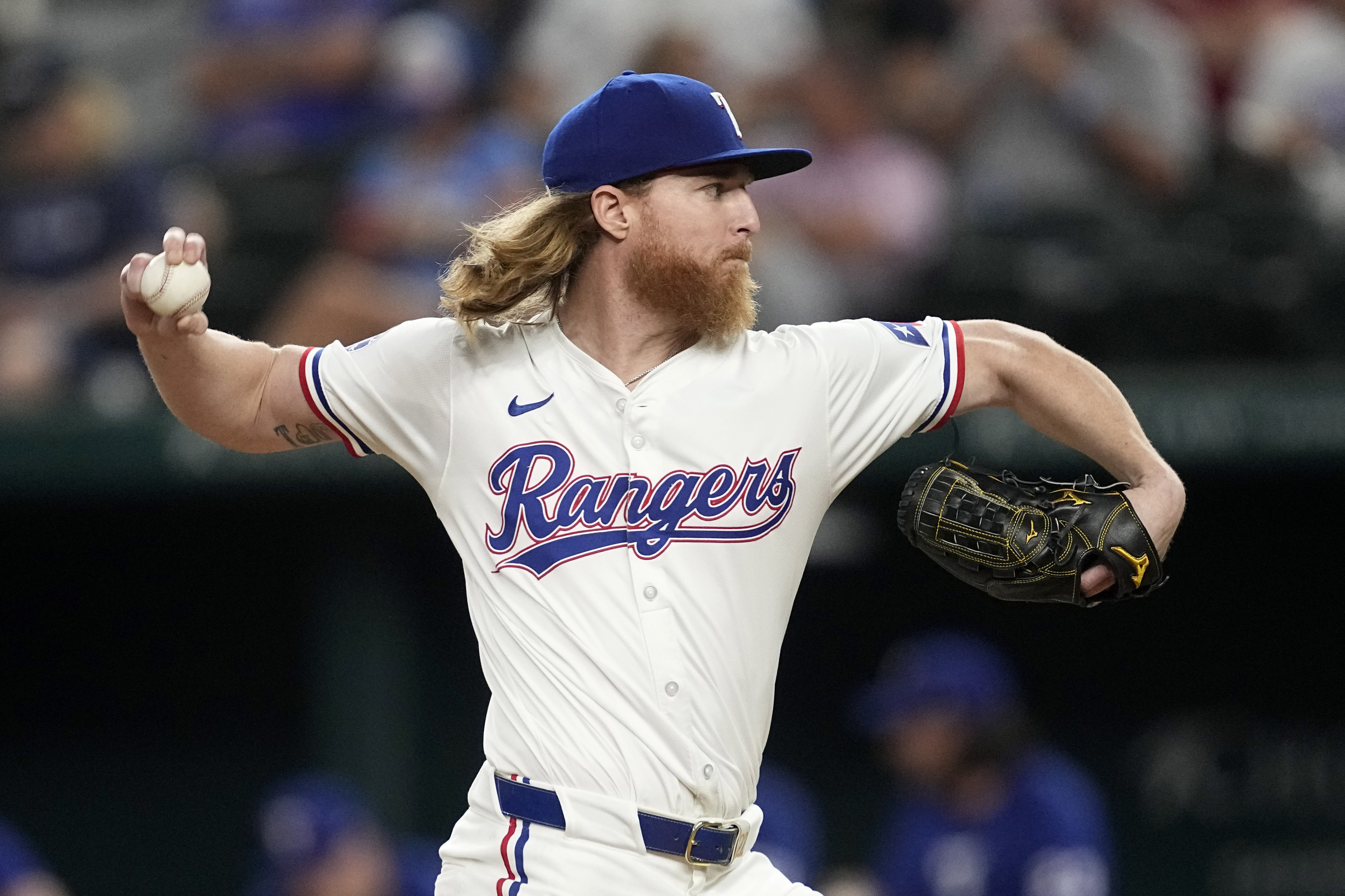 Texas Rangers starting pitcher Jon Gray throws to the Chicago White Sox in the sixth inning of a baseball game, Tuesday, July 23, 2024, in Arlington, Texas.