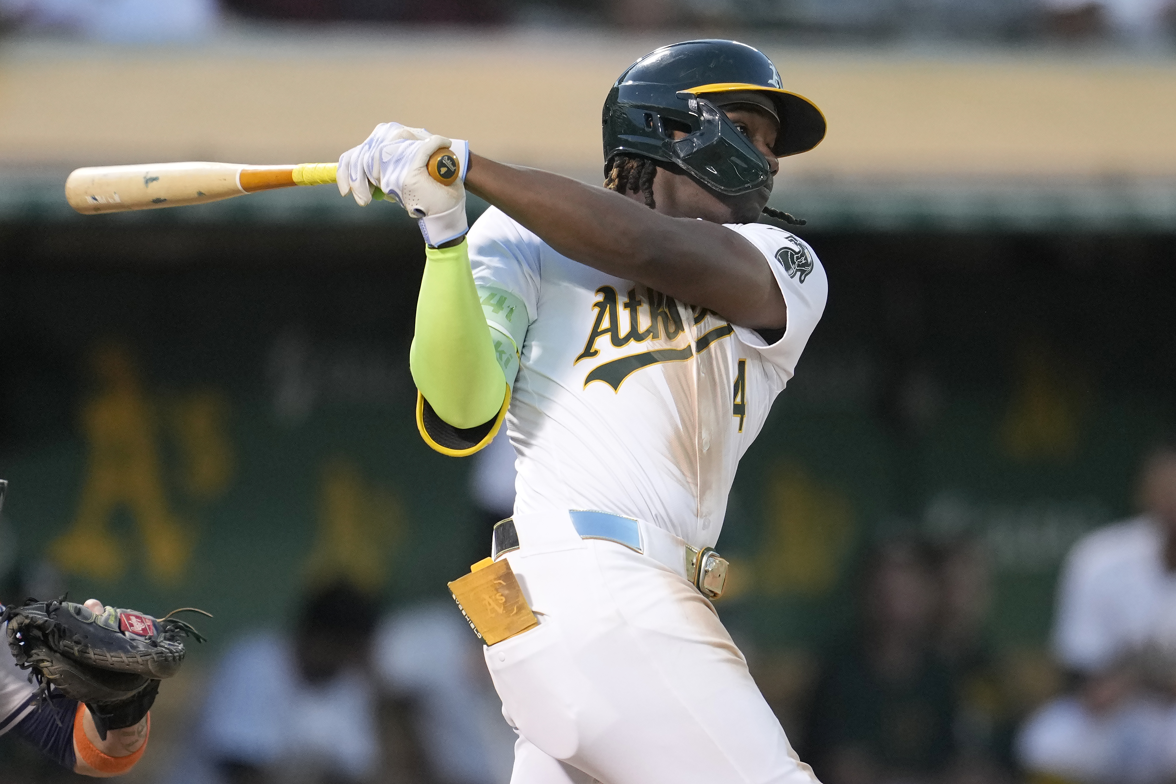 Oakland Athletics' Lawrence Butler hits an RBI double against the Houston Astros during the sixth inning of a baseball game in Oakland, Calif., Tuesday, July 23, 2024. 