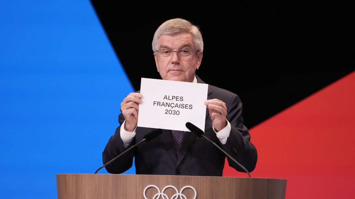 IOC president Thomas Bach announces that the French Alps was named as the 2030 Winter Games host at the 2024 Summer Olympics, Wednesday, July 24, 2024, in Paris, France. The French Alps was named as the 2030 Winter Games host by the International Olympic committee on Wednesday, though with conditions attached.