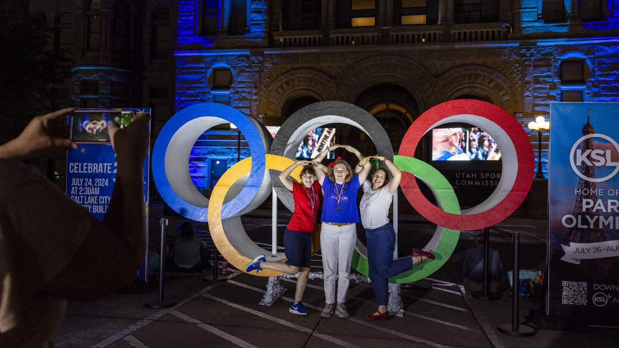 From left, sisters Maya, 13, and Eliana, 15, and their mother Jordan Anderson at a party for the Winter Olympics bid at the Salt Lake City-County Building July 24, 2024. Bills targeting stadiums and sports venues advanced in a Senate committee Thursday.