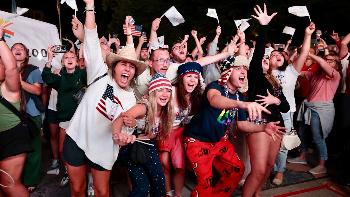Attendees cheer after the International Olympic Committee awarded the 2034 Winter Olympic Games to the Salt Lake City-Utah Committee during a live watch party held at the Salt Lake City-County Building early Wednesday.