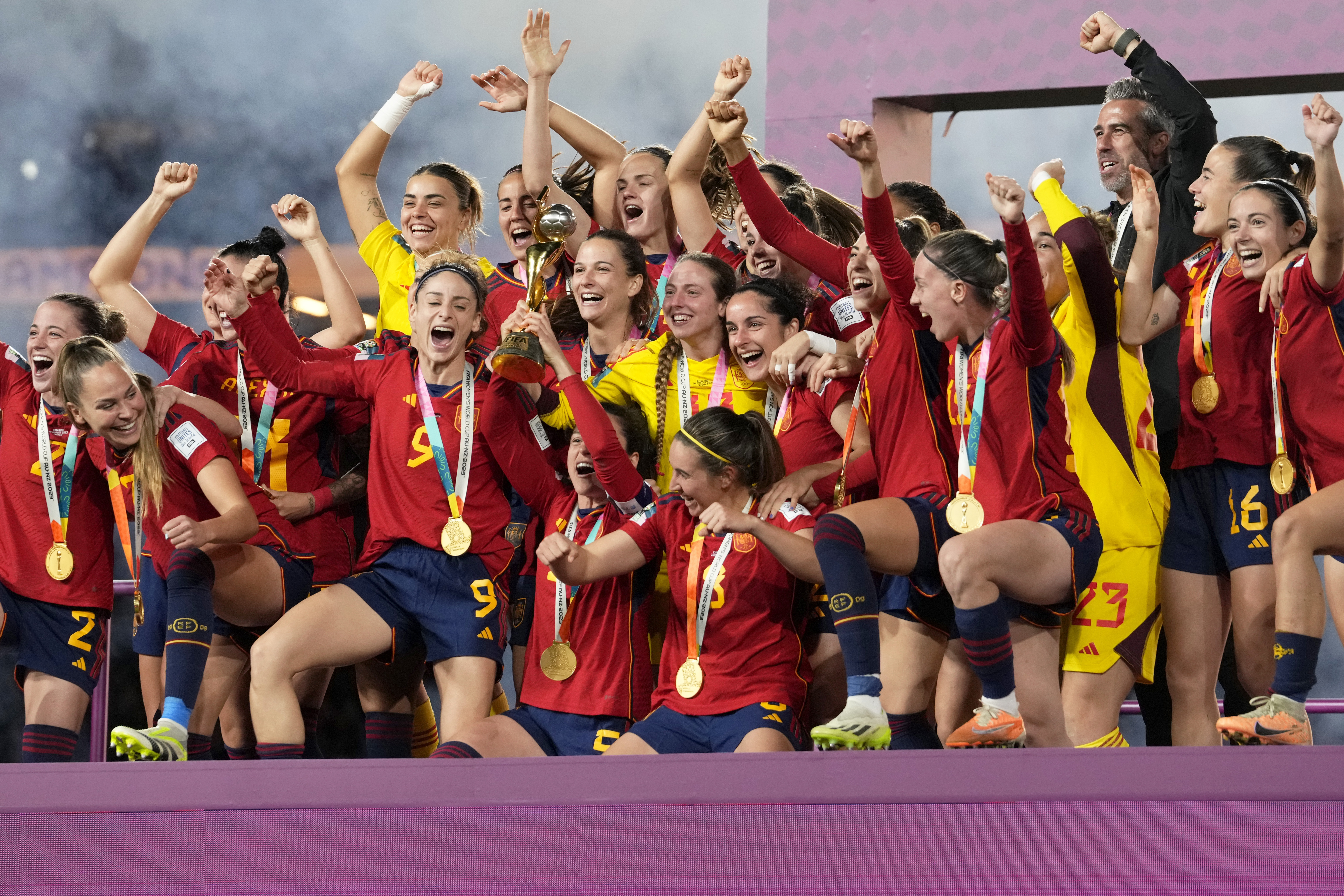FILE - Spain players celebrate with the trophy at the end of the Women's World Cup soccer final between Spain and England at Stadium Australia in Sydney, Australia Aug. 20, 2023. Spain comes into the Olympics hoping to build off its Women’s World Cup success and move on from the tumult of the past.