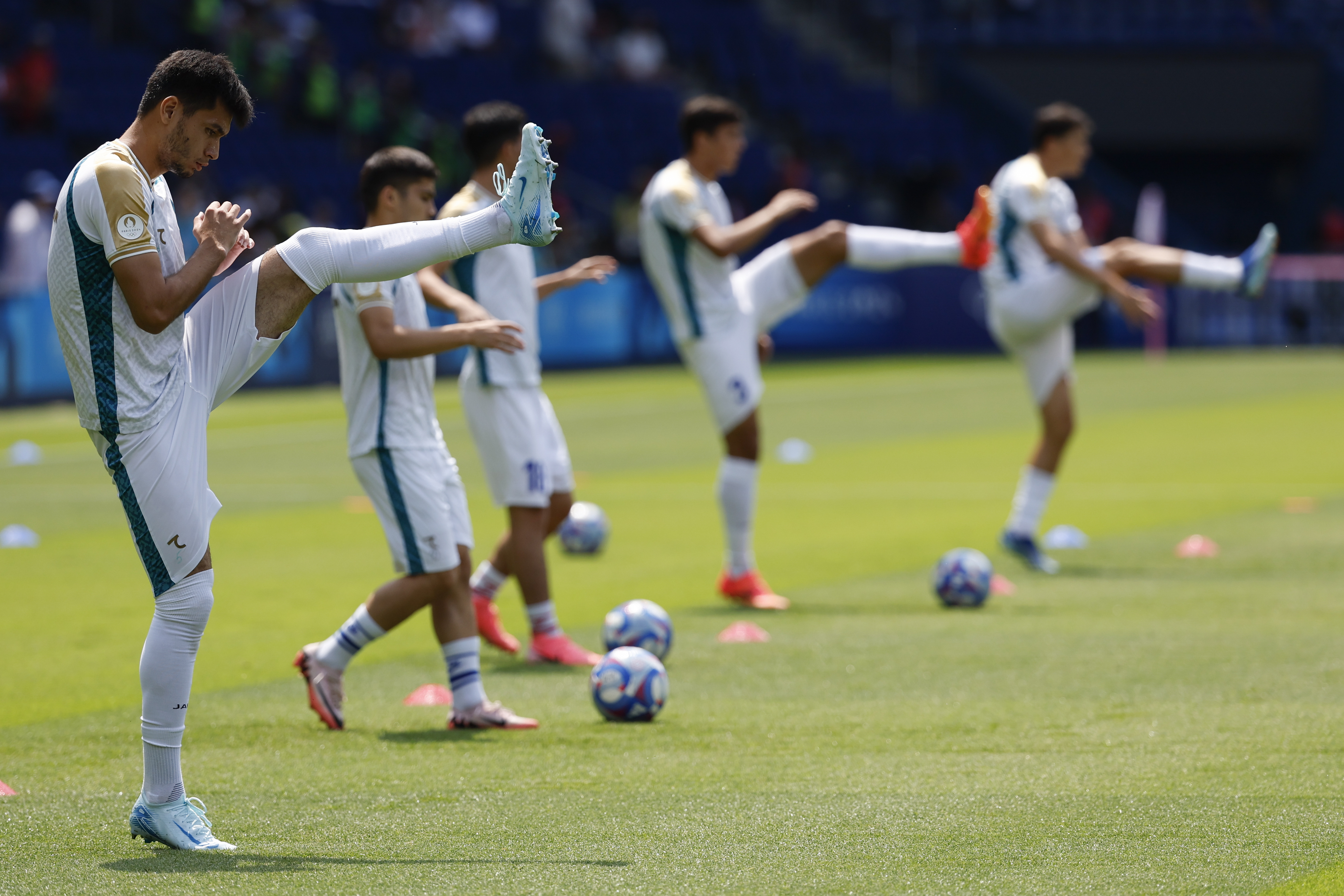 Uzbekistan players warm up ahead of the men's group C match between Uzbekistan and Spain at the Parc des Princes during the 2024 Summer Olympics, Wednesday, July 24, 2024, in Paris, France.