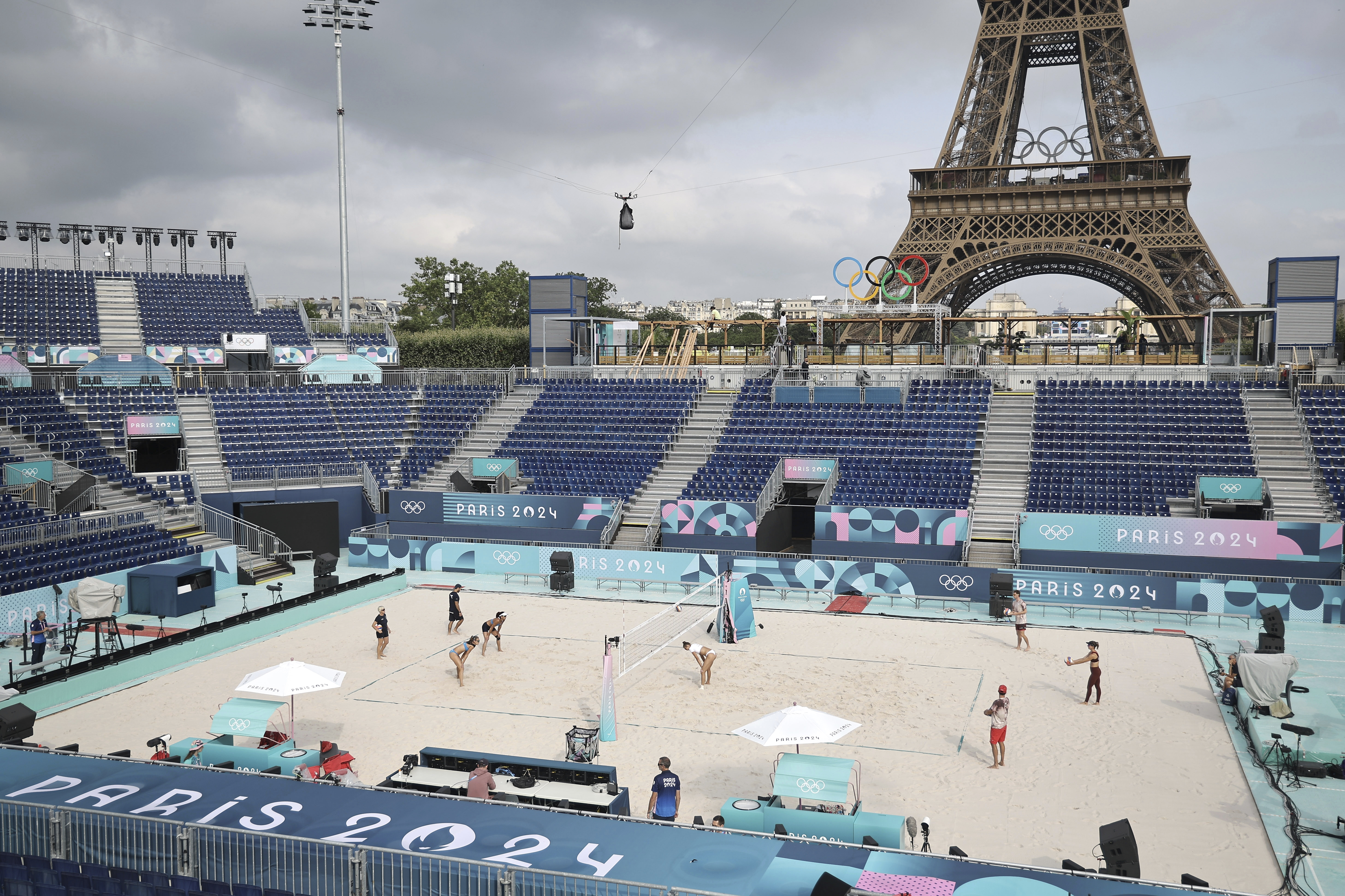 Athletes play at the Tour Eiffel stadium that will host the Beach Volleyball on the Champs-de-Mars, at the 2024 Summer Olympics in Paris, France, Wednesday July 24 2024. 