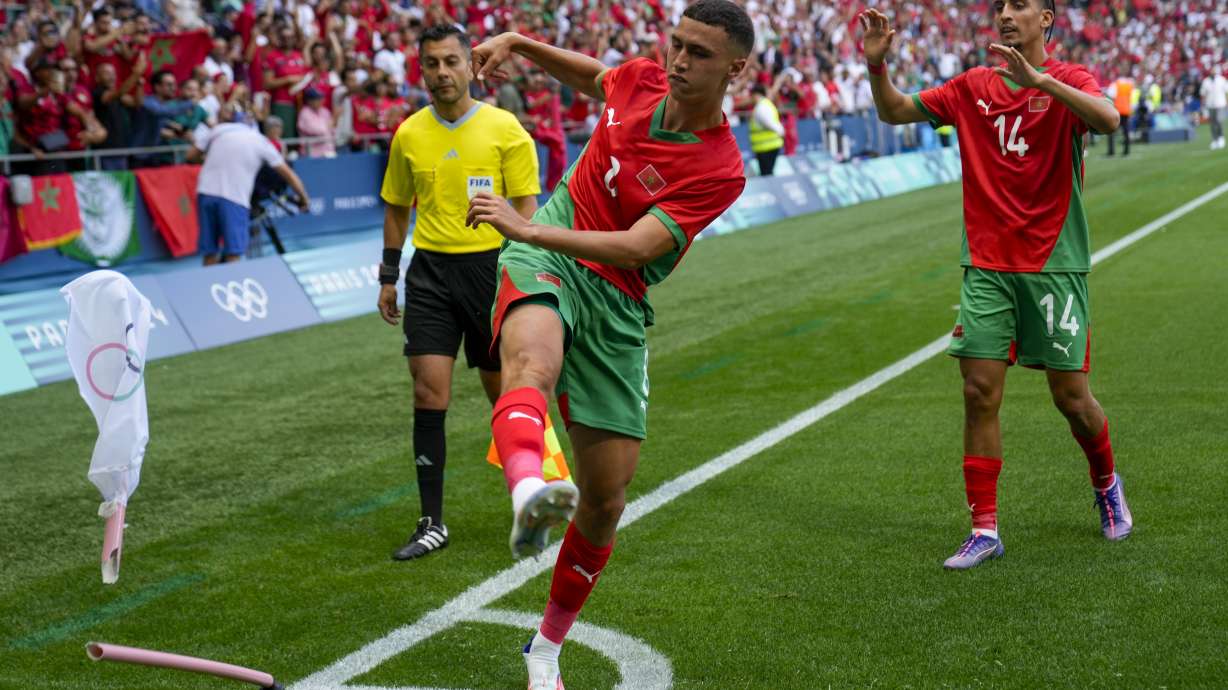 Morocco's Bilal El Khannouss, center, celebrates after his assist for Soufiane Rahimi opening goal during the men's Group B soccer match between Argentina and Morocco at Geoffroy-Guichard Stadium at the 2024 Summer Olympics, Wednesday, July 24, 2024, in Saint-Etienne, France.