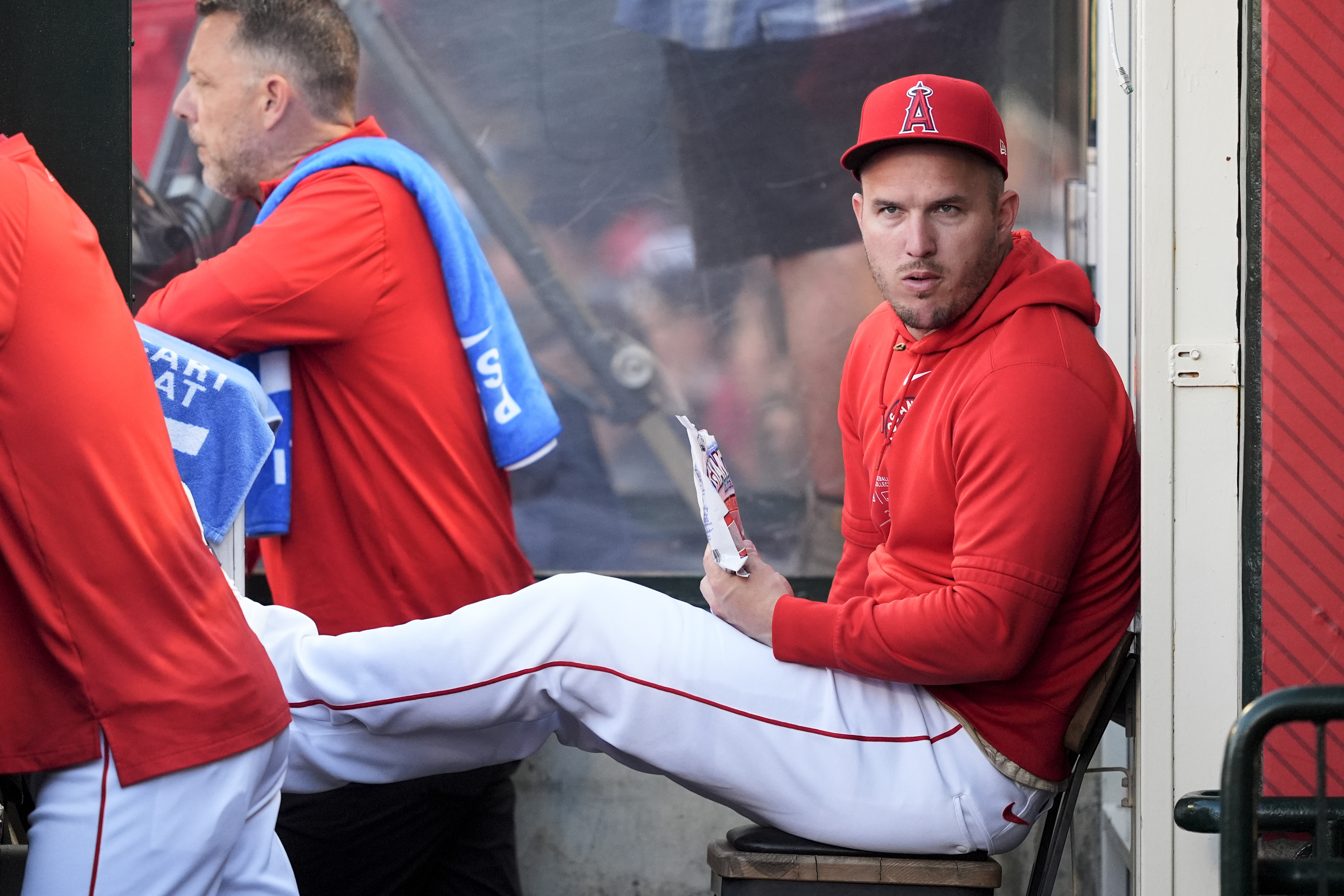 Los Angeles Angels center fielder Mike Trout sits in the dugout during the first inning of the team's baseball game against the Oakland Athletics, Tuesday, June 25, 2024, in Anaheim, Calif. 