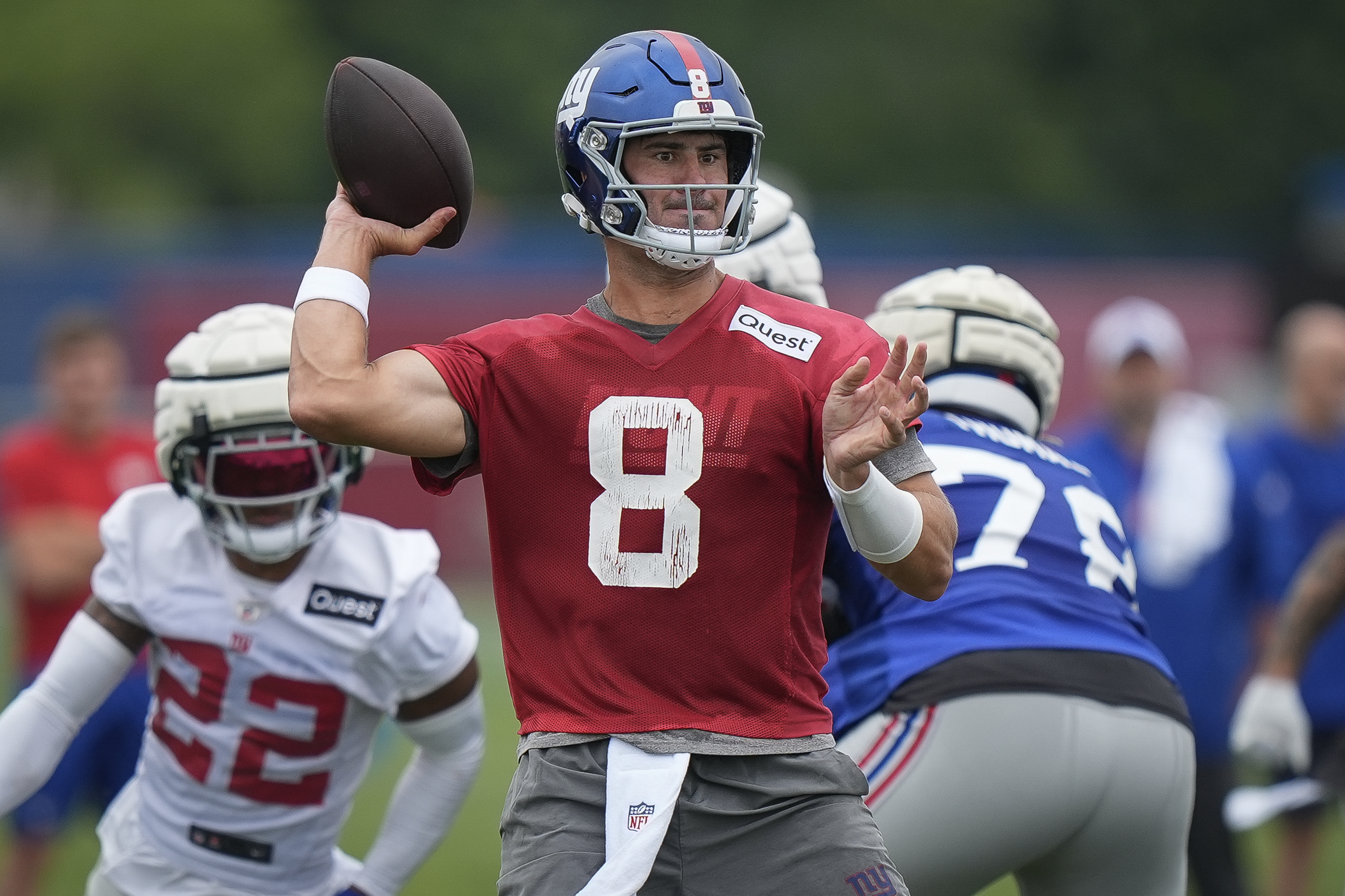 New York Giants quarterback Daniel Jones (8) throws a pass during NFL football training camp, Wednesday, July 24, 2024, in East Rutherford, N.J. 