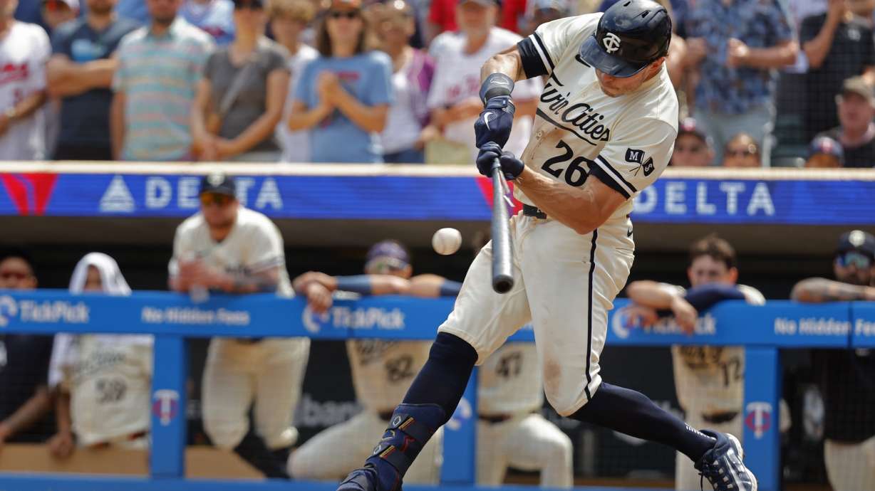 Minnesota Twins' Max Kepler hits a game-winning RBI infield single against the Philadelphia Phillies in the ninth inning of a baseball game Wednesday, July 24, 2024, in Minneapolis.