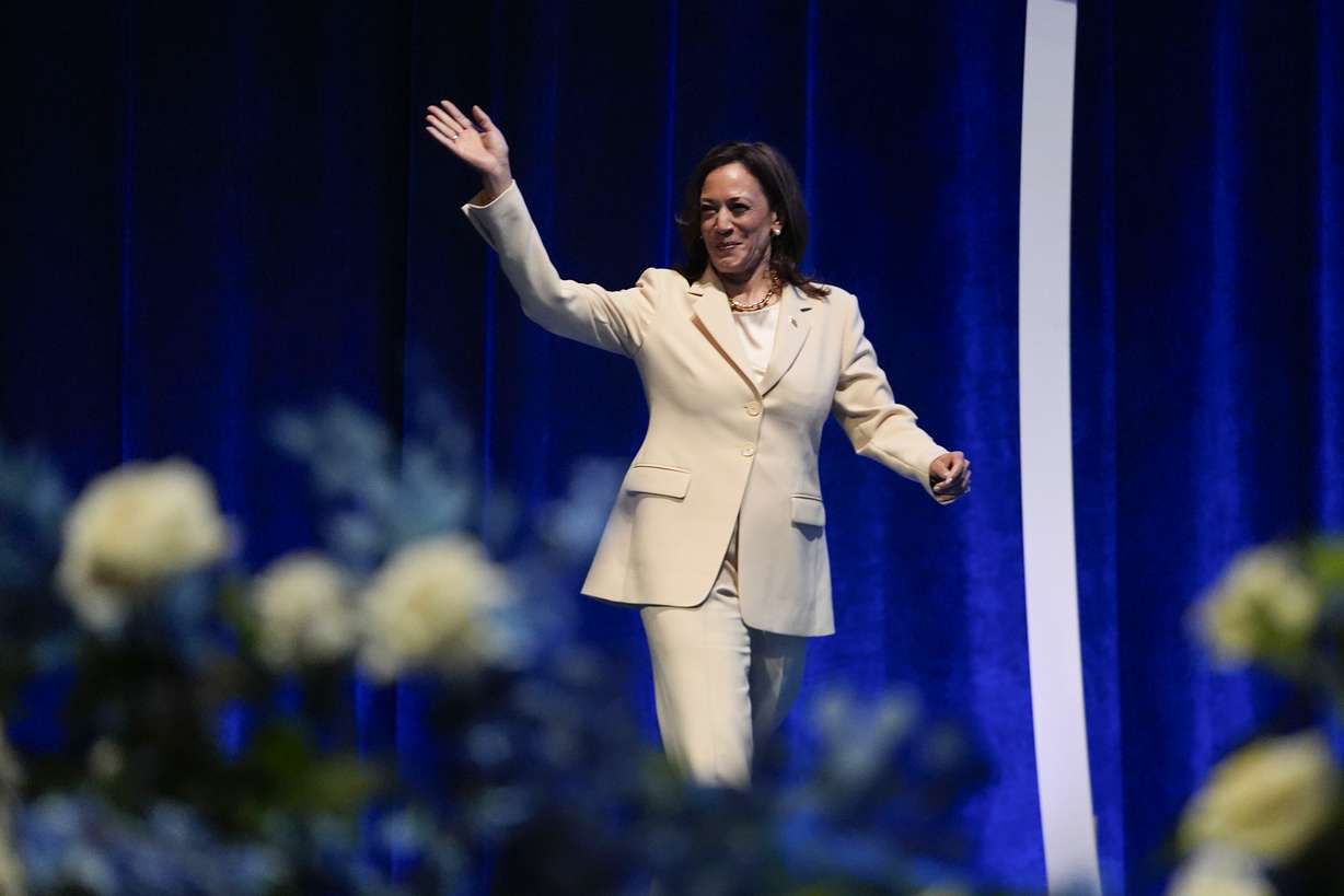 Vice President Kamala Harris waves as she is introduced during the Zeta Phi Beta Sorority, Inc.'s Grand Boulé, Wednesday, in Indianapolis.