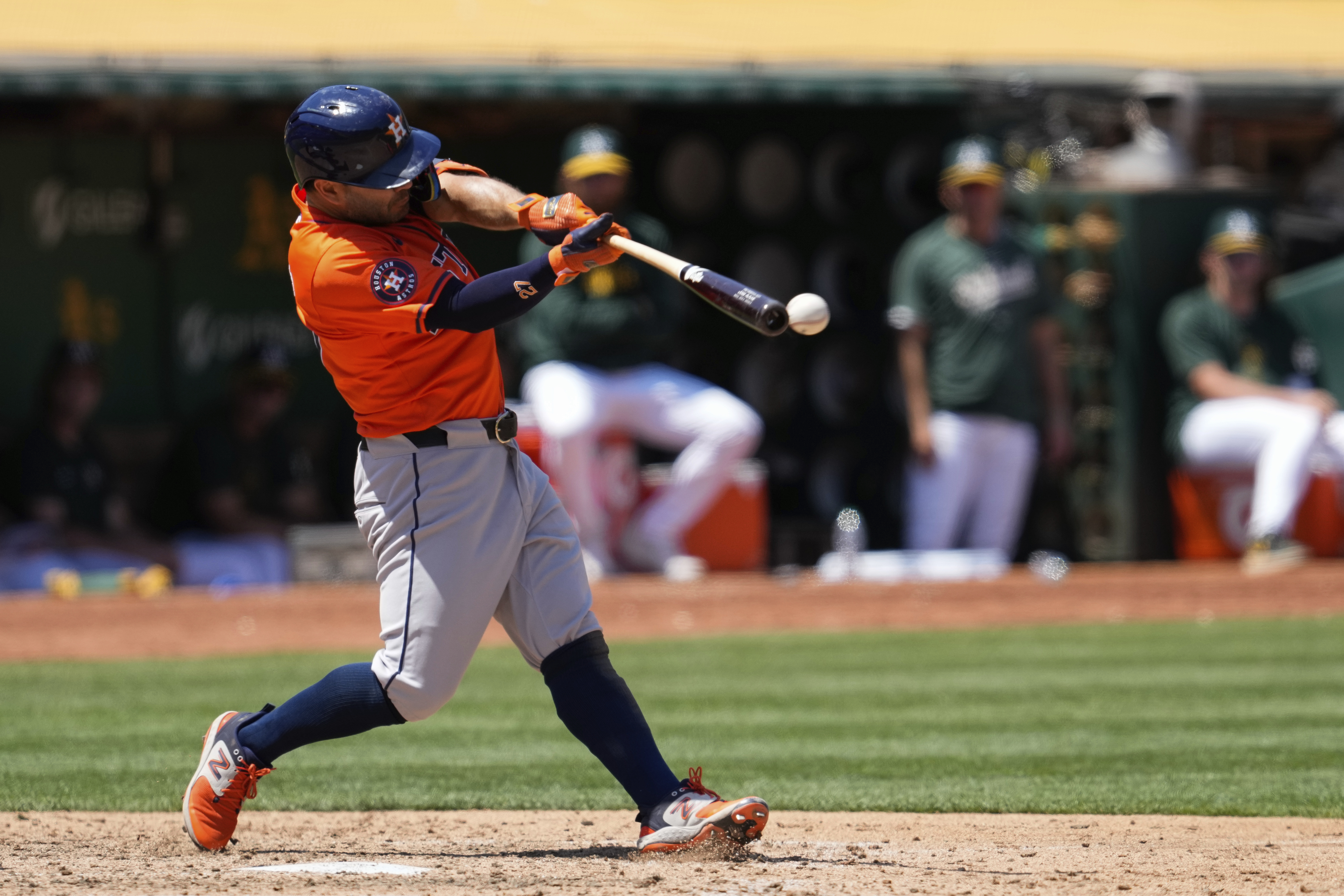 Houston Astros' Jose Altuve hits an RBI double against the Oakland Athletics during the seventh inning of a baseball game, Wednesday, July 24, 2024, in Oakland, Calif. 