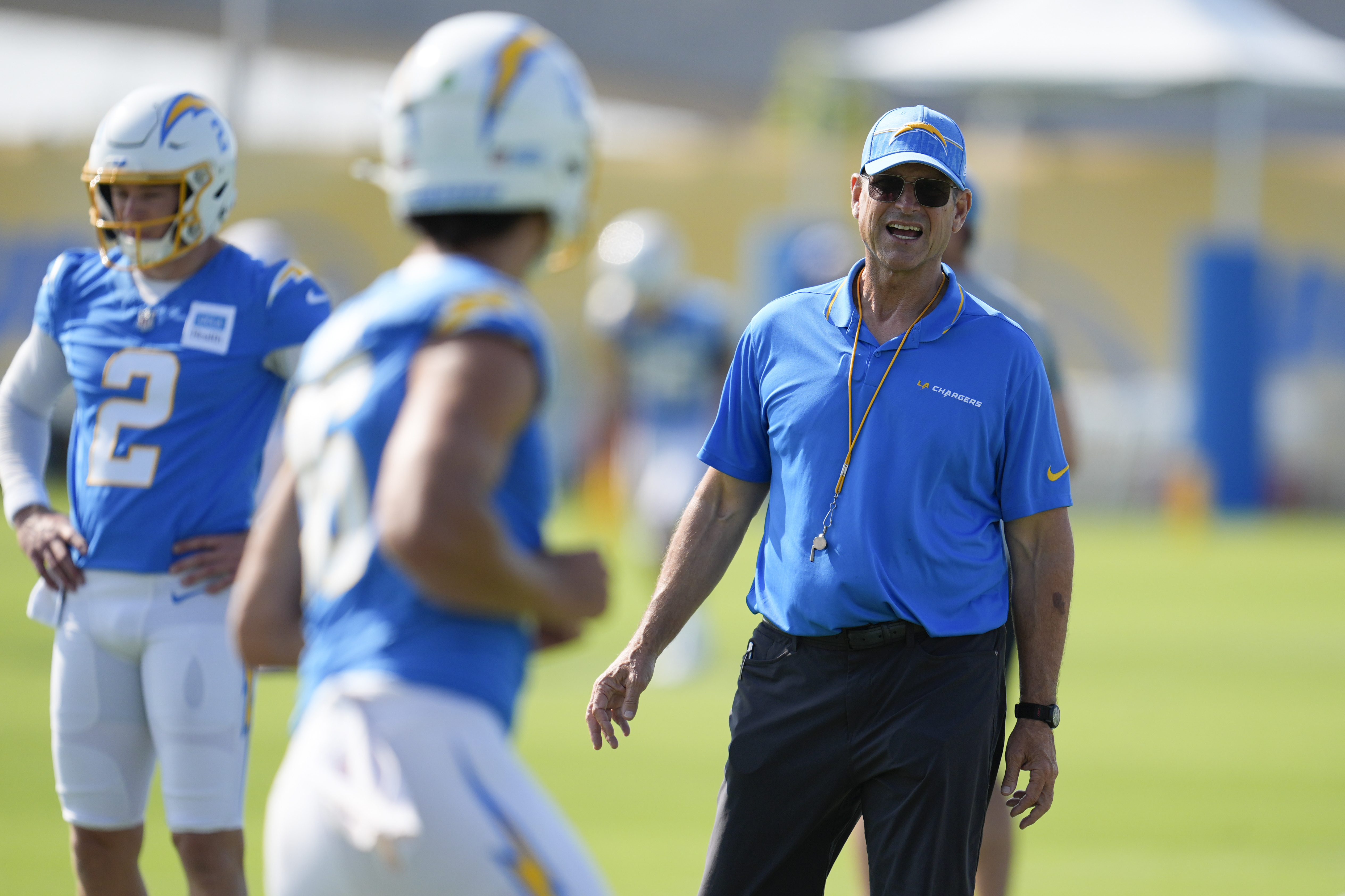 Los Angeles Chargers head coach Jim Harbaugh instructs on the field during NFL football training camp Wednesday, July 24, 2024, in El Segundo, Calif. 