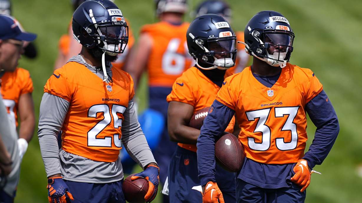 FILE - Denver Broncos running backs, from left, Samaje Perine, Tyler Badie and Javonte Williams take part in drills during NFL football practice at the team's headquarters Tuesday, June 4, 2024, in Centennial, Colo.