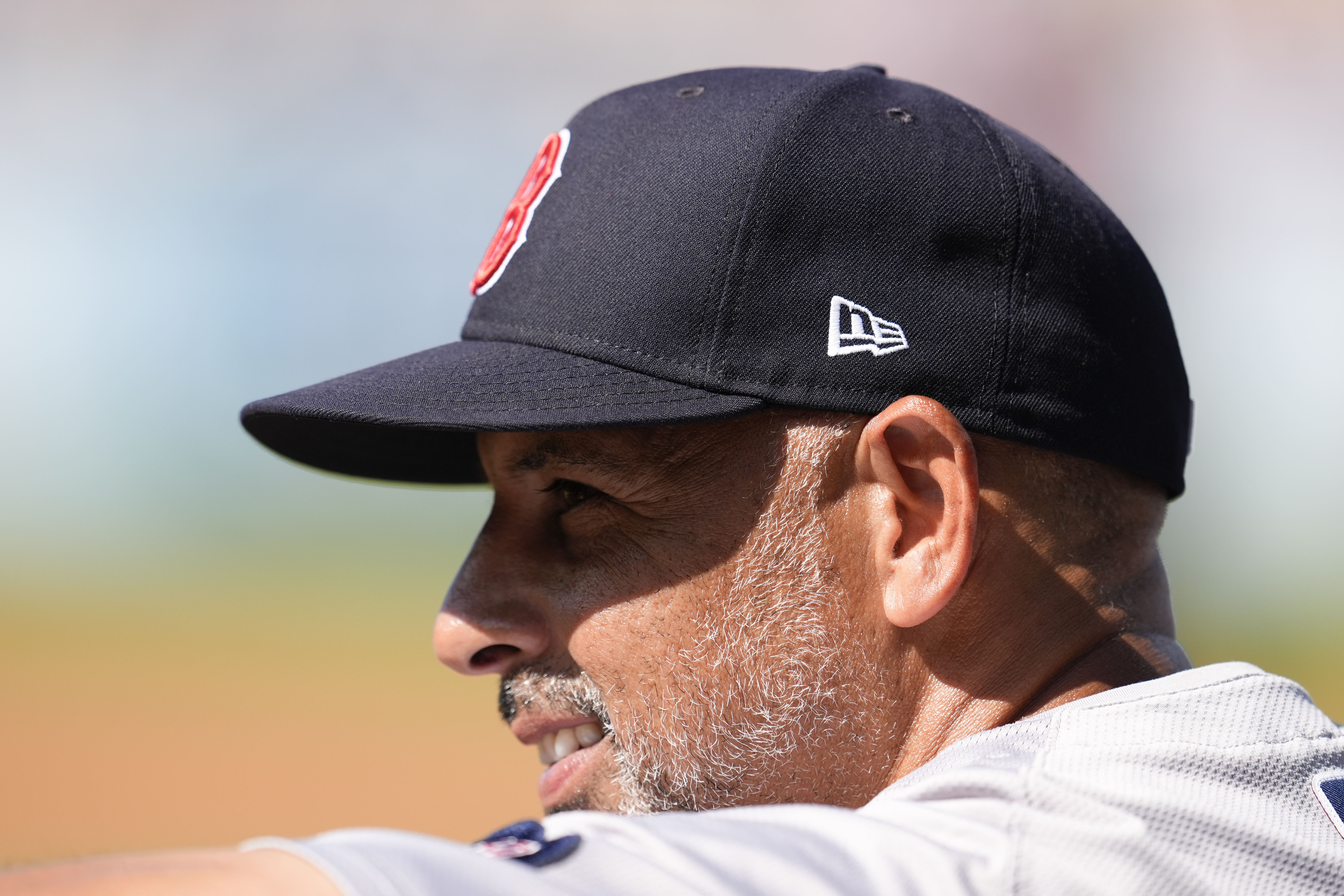 Boston Red Sox manager Alex Cora watches from the dugout during the first inning of a baseball game against the Los Angeles Dodgers, Saturday, July 20, 2024, in Los Angeles. 