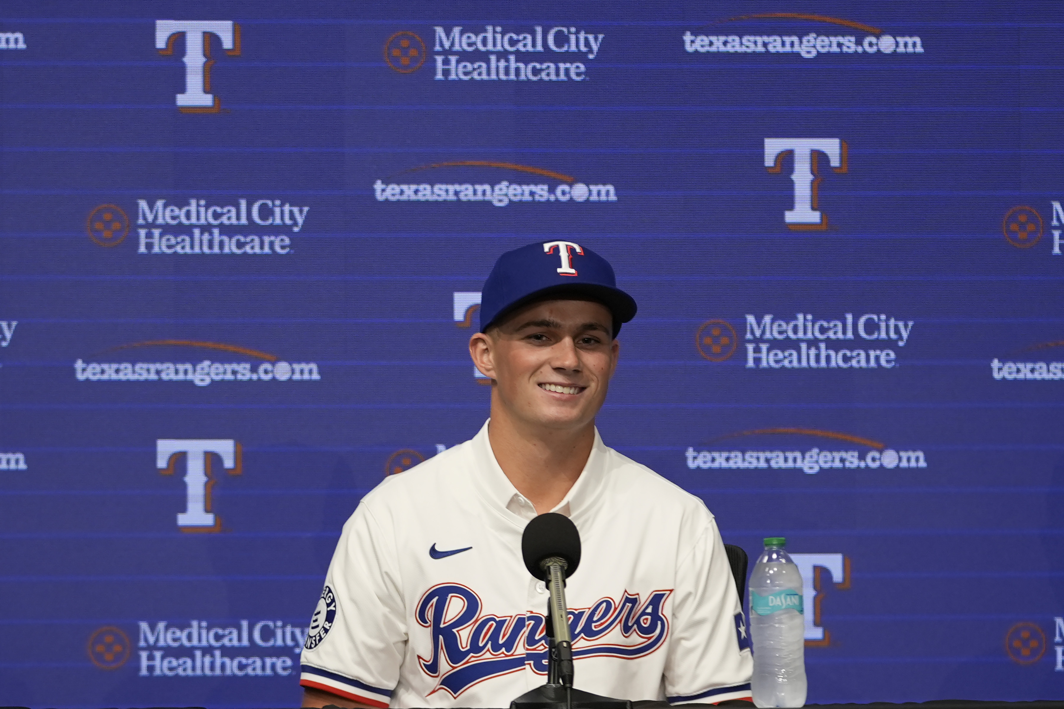 Texas Rangers first round draft pick catcher Malcolm Moore smiles during a news conference in Arlington, Texas, Wednesday, July 24, 2024. 