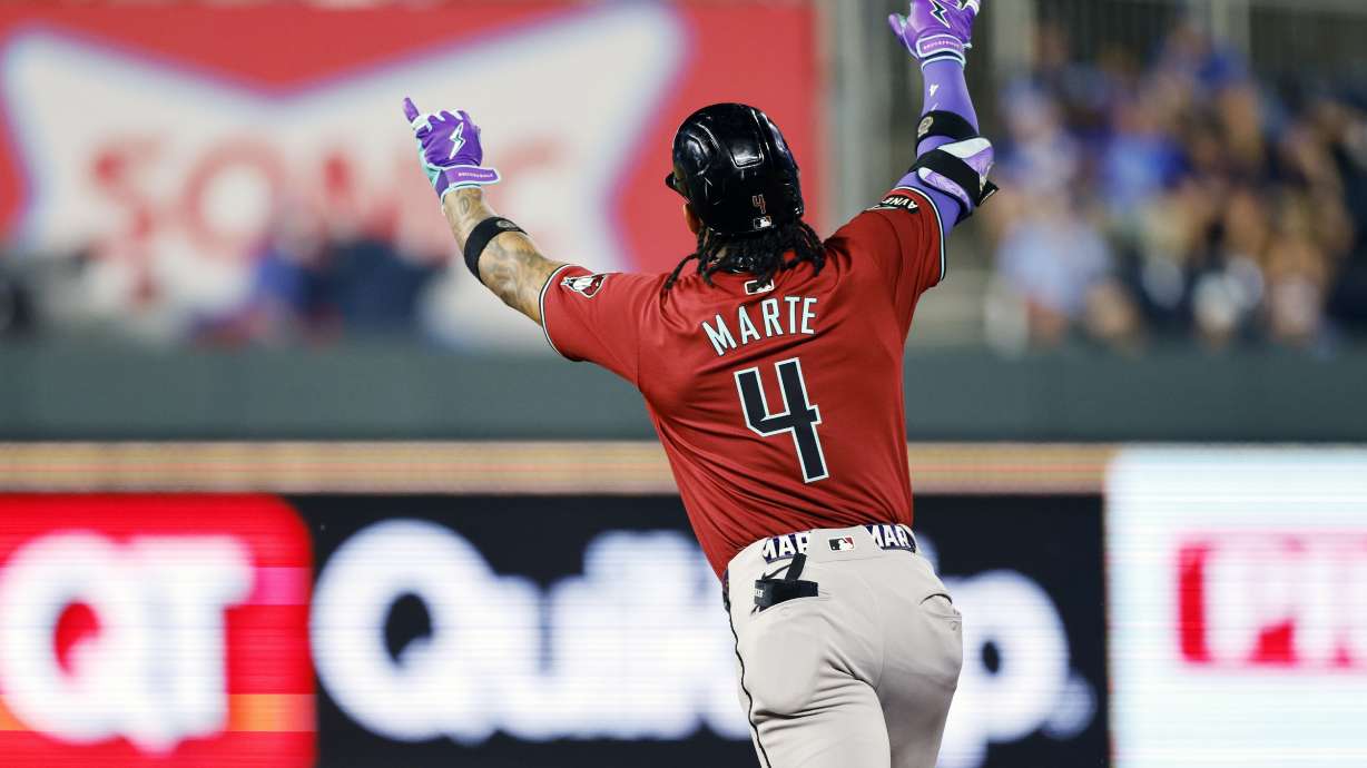Arizona Diamondbacks' Ketel Marte celebrates hitting a three-run home during the ninth inning of a baseball game against the Kansas City Royals in Kansas City, Mo., Wednesday, July 24, 2024.