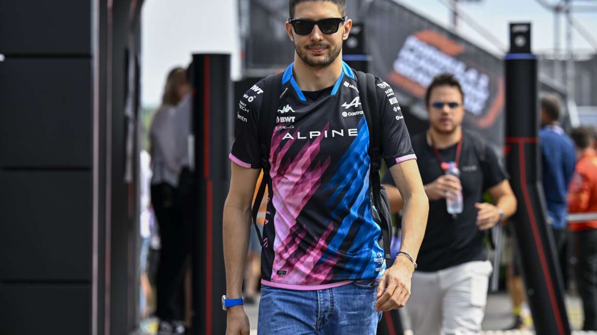 Alpine driver Esteban Ocon of France arrives in the paddock before of the third free practice ahead of Sunday's Formula One Hungarian Grand Prix auto race, at the Hungaroring racetrack in Mogyorod, near Budapest, Hungary, Saturday, July 20, 2024.