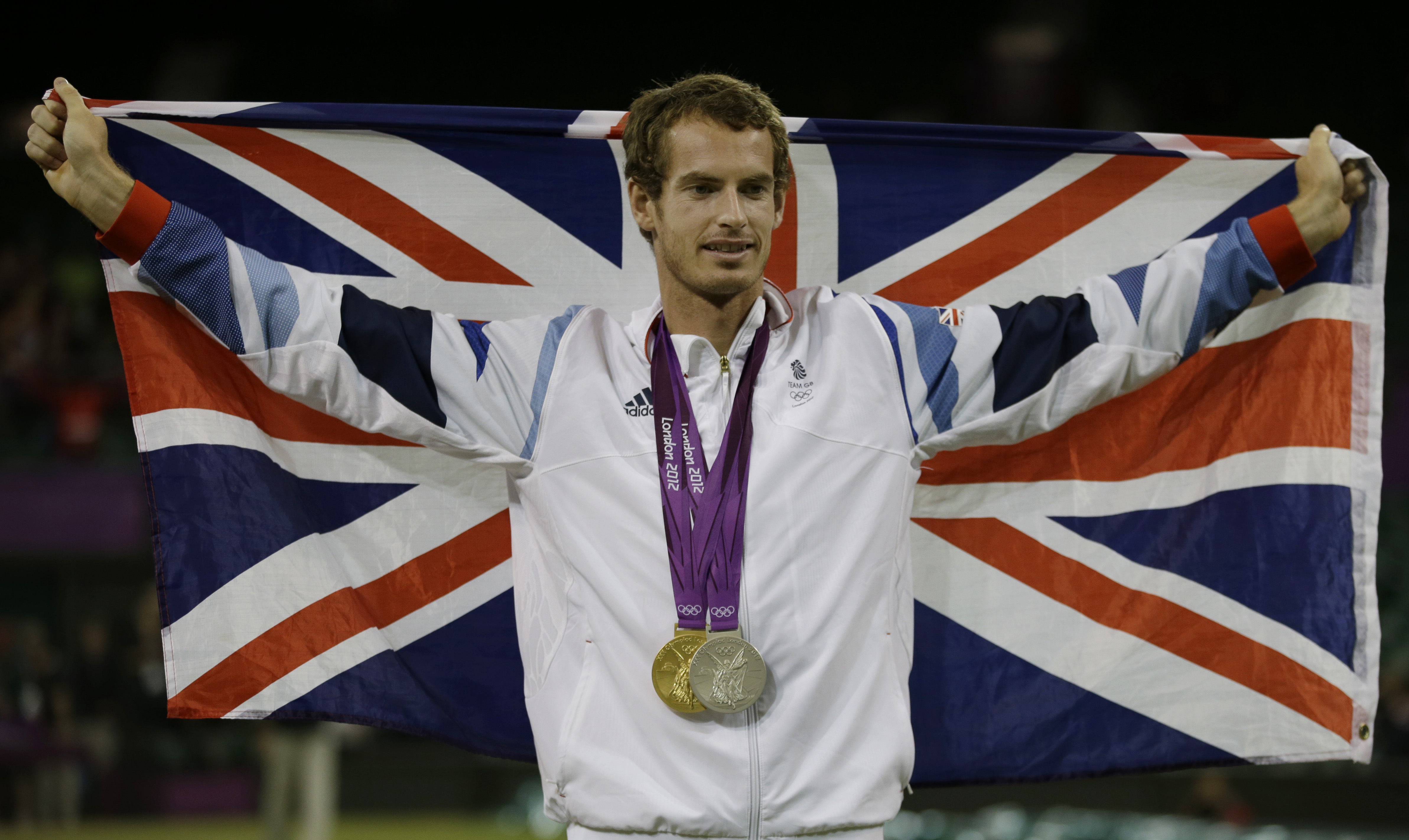 FILE - Andy Murray of Great Britain poses with his gold and silver medals in tennis at the All England Lawn Tennis Club in Wimbledon, London at the 2012 Summer Olympics, Sunday, Aug. 5, 2012. The tennis competition at the Paris Olympics could be where past gold medalists Rafael Nadal and Andy Murray bid adieu to the sport.
