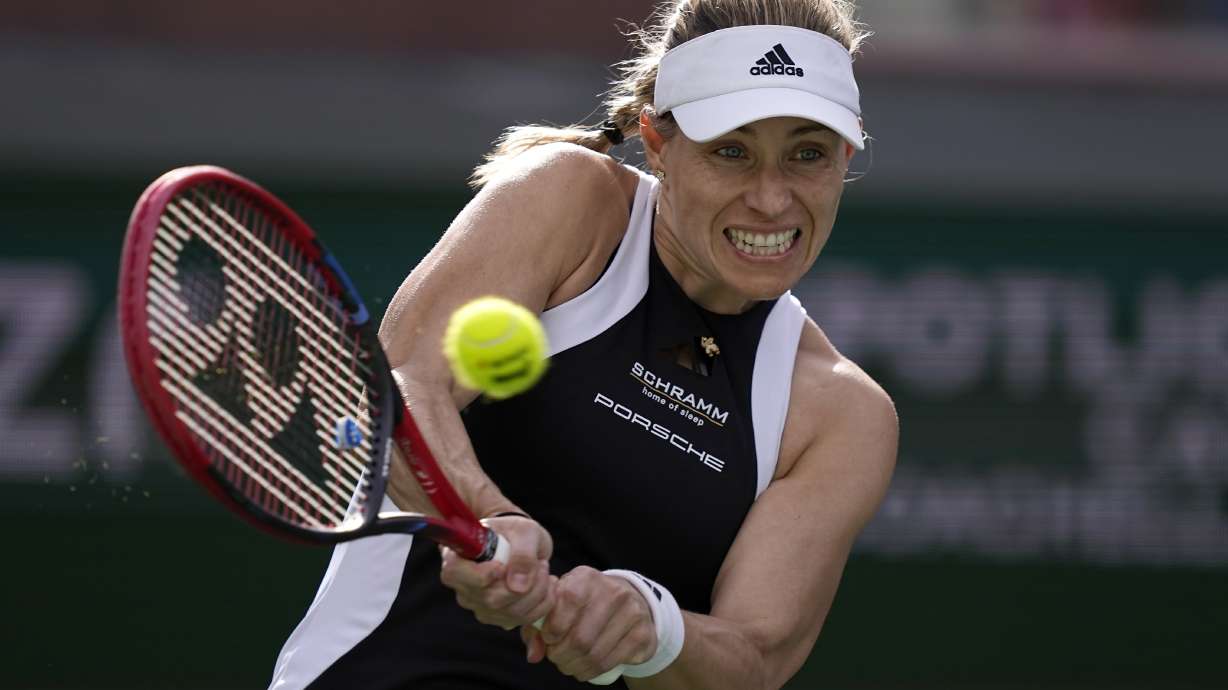 FILE - Angelique Kerber, of Germany, returns a shot against Veronika Kudermetova, of Russia, at the BNP Paribas Open tennis tournament in Indian Wells, Calif., Sunday, March 10, 2024. Three-time Grand Slam champion Angelique Kerber announced Thursday, July 25, 2024 that she will retire after the Paris Olympics.