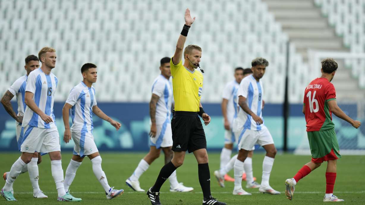 Referee Glenn Nyberg disallows a goal scored by Argentina's Cristian Medina during the Men's Group B soccer match between Argentina and Morocco at Geoffroy-Guichard stadium during the 2024 Summer Olympics, Wednesday, July 24, 2024, in Saint-Etienne, France.