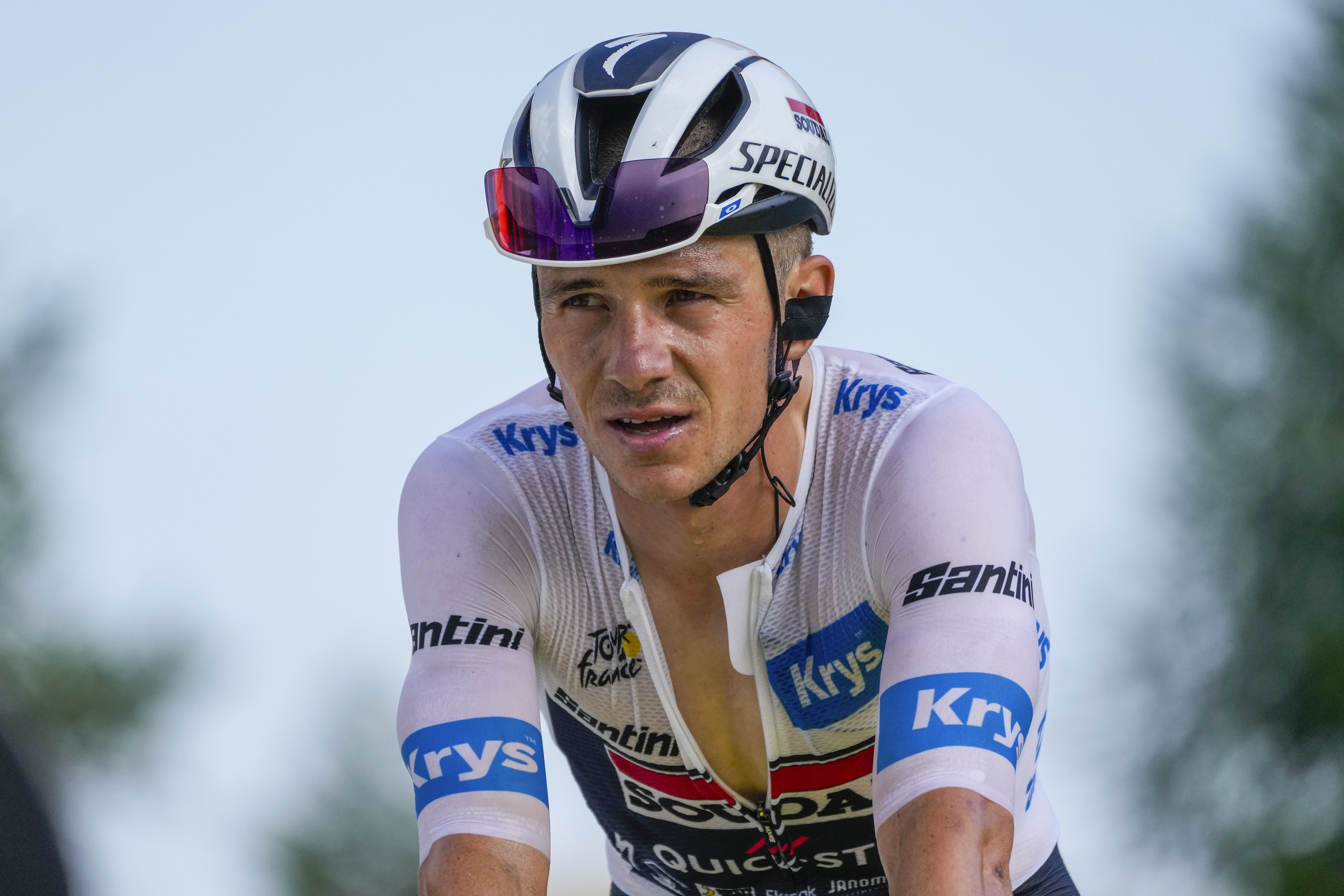 Belgium's Remco Evenepoel, wearing the best young rider's white jersey, strains as he crosses the finish line of the twentieth stage of the Tour de France cycling race over 132.8 kilometers (82.5 miles) with start in Nice and finish in La Couillole pass, France, Saturday, July 20, 2024. 