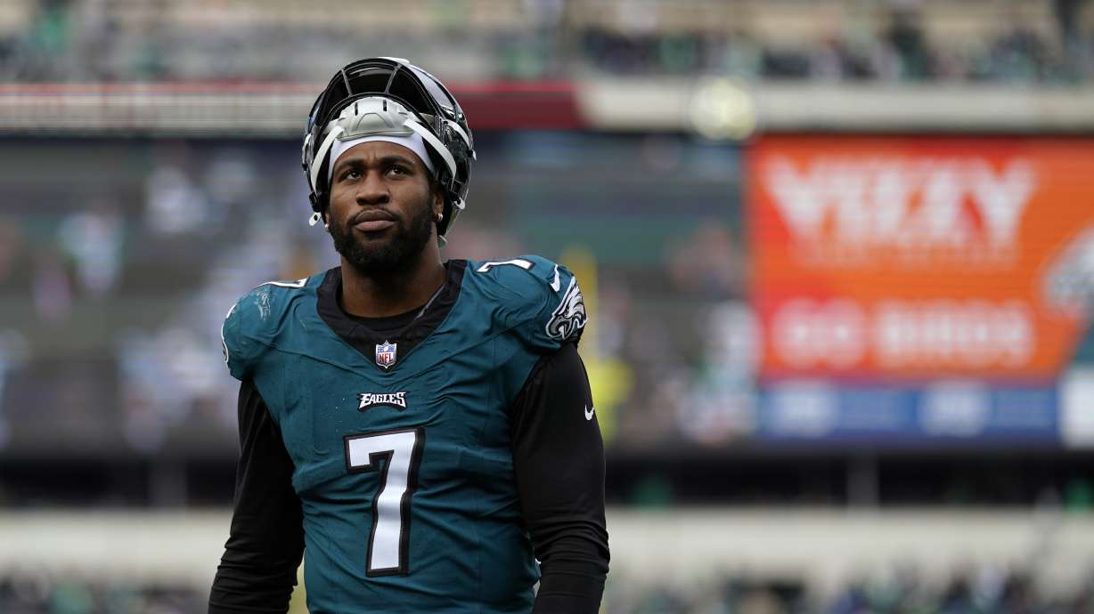 FILE - Then-Philadelphia Eagles' Haason Reddick walks off the field at halftime of an NFL football game, Sunday, Dec. 31, 2023, in Philadelphia. A person with knowledge of the situation says New York Jets defensive end Haason Reddick is not planning to report to training camp with the rest of his teammates as he seeks a new contract. Reddick was acquired from Philadelphia during the offseason and is scheduled to make $14.25 million in base salary in the final year of his deal.