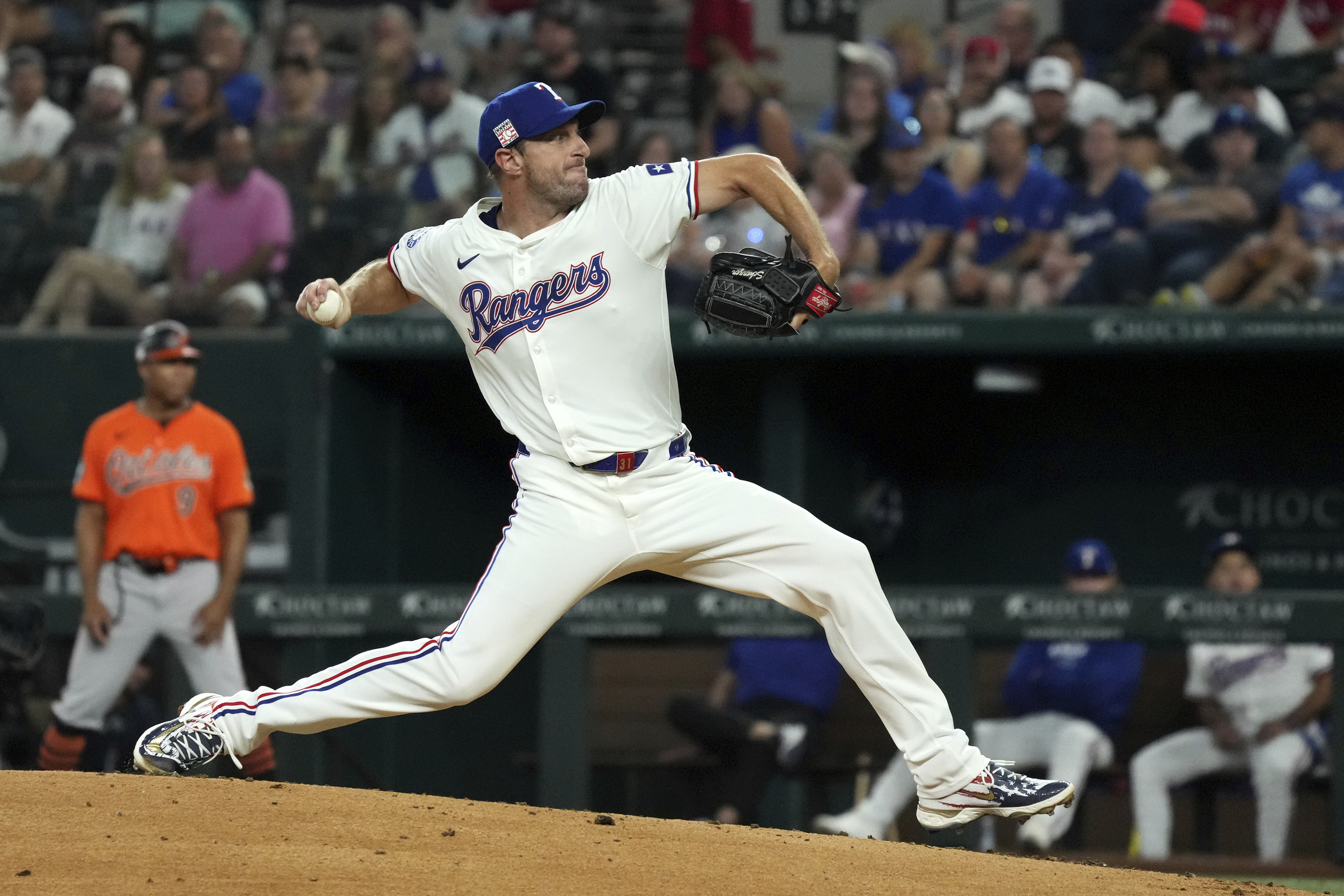 Texas Rangers starting pitcher Max Scherzer works against the Baltimore Orioles during the first inning of a baseball game Saturday, July 20, 2024, in Arlington, Texas. 