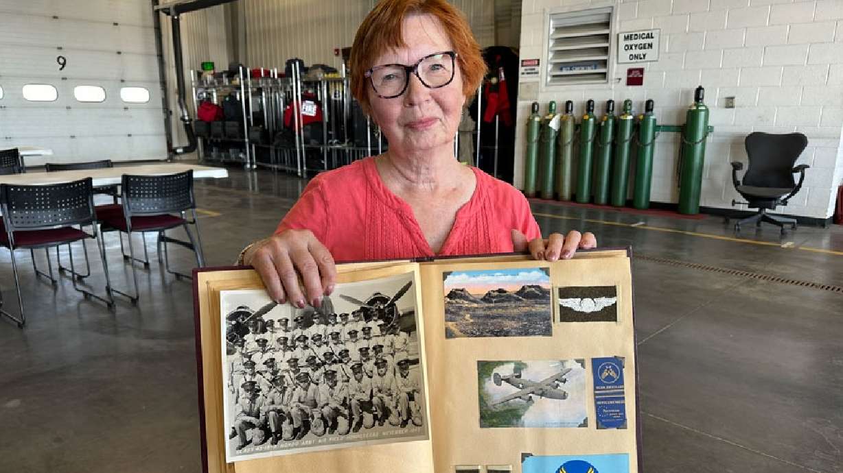 Roberta Armstrong displays her scrapbook about her father in this undated photo.